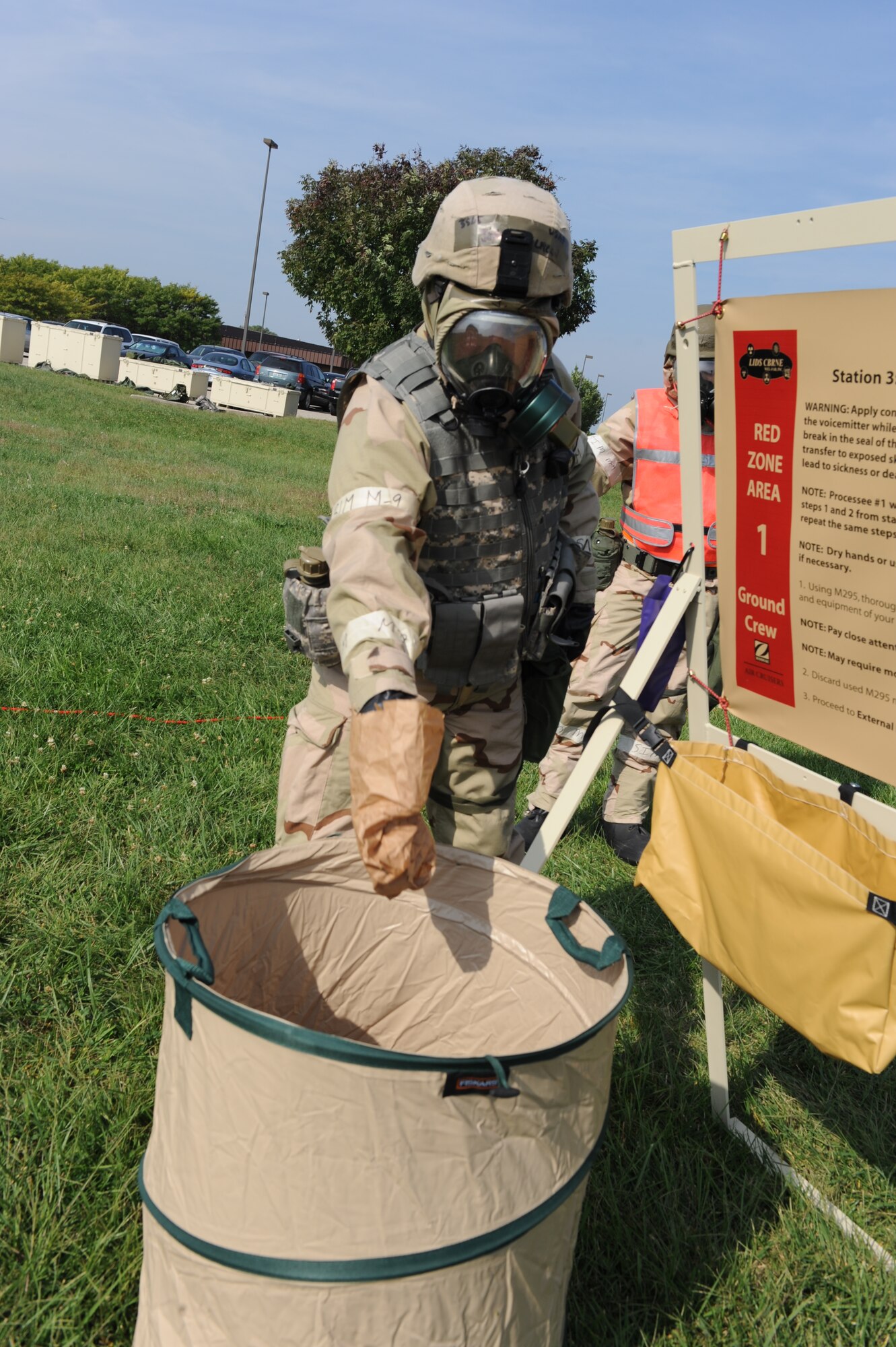 WHITEMAN AIR FORCE BASE, Mo. – a member of the 442nd Fighter Wing throws away a contaminated paper bag while possessing through a chemical line during an exercise, Sept. 16. The 442nd Fighter Wing has exercise to ensure their members remain current on their readiness training. (U.S. Air Force Photo/ SrA Cory Todd)