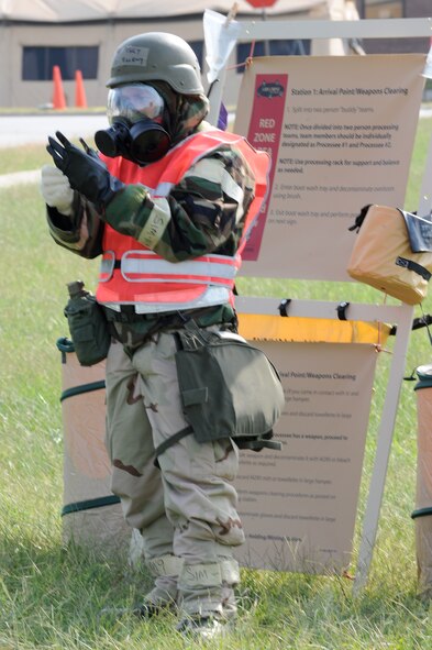 WHITEMAN AIR FORCE BASE, Mo. – Staff Sgt. Otto Briery, 442nd Fighter Wing, puts on his chemical gloves during an exercise, Sept. 16. The 442nd Fighter Wing has exercise to ensure their members remain current on their readiness training. (U.S. Air Force photo/Senior Airman Cory Todd)