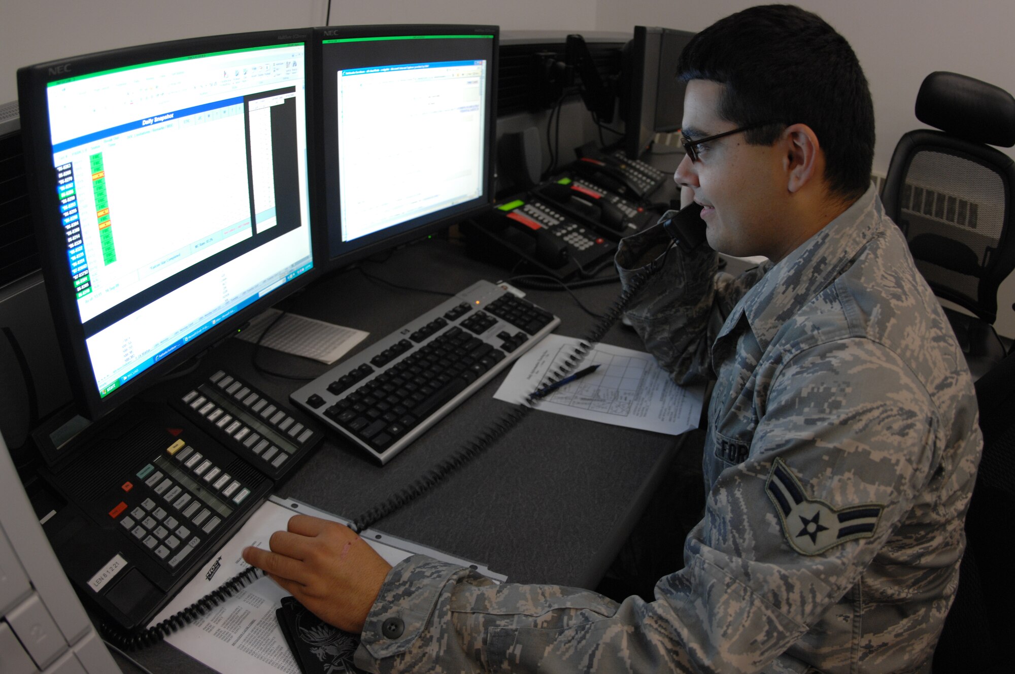 Airman 1st Class Julio Oseguera records maintenance information on the repair of an aircraft Sept. 14, 2009, Eielson Air Force Base, Alaska. Airman Oseguera is assigned to the 354th Maintenance Group Maintenance Operations Center, which is responsible for tracking the repair of each aircraft on station. (U.S. Air Force photo/Airman 1st Class Rachelle Coleman)