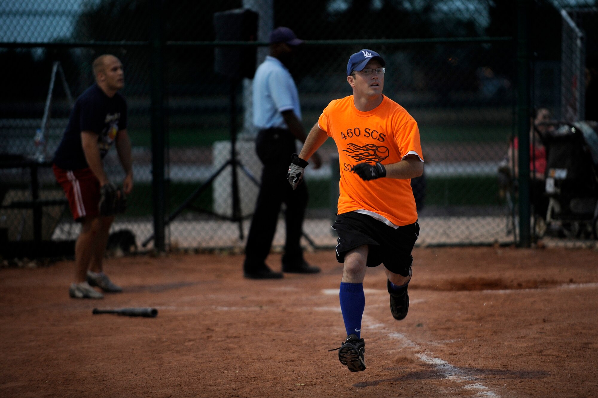 BUCKLEY AIR FORCE BASE, Colo. – Robert Shaw, 460th Space Communications Squadron, runs to first after a hit during the softball finals Sept. 14. The 460th Space Communications Squadron beat Naval Information Operations Command – Colorado 16-6 and 13-3 in a double elimination base championship final.  (U.S. Air Force photo by Senior Airman Steven Czyz)