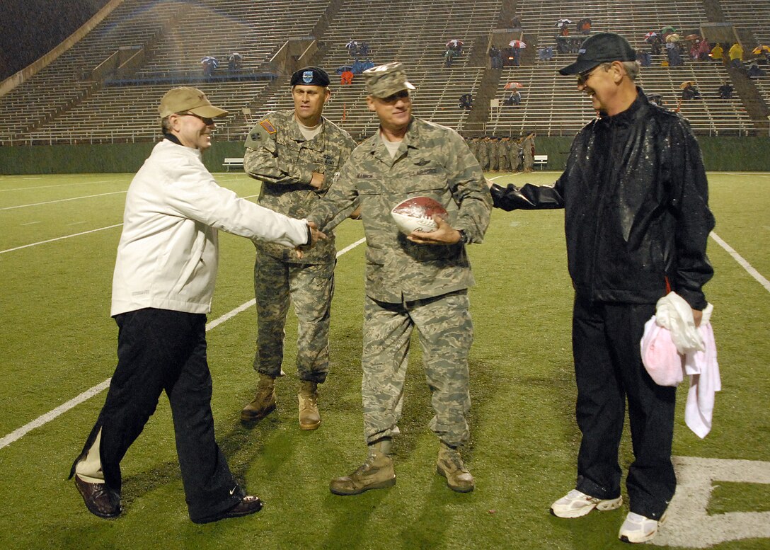 Brig. Gen. O. G. Mannon commander of the 82nd Training Wing receives a football as a memento Sept. 12 from the Midwestern State University during the school’s Salute to Military football game. Every year MSU sets aside a game to honor Airmen, Soldiers, Sailors and Marines for serving. 