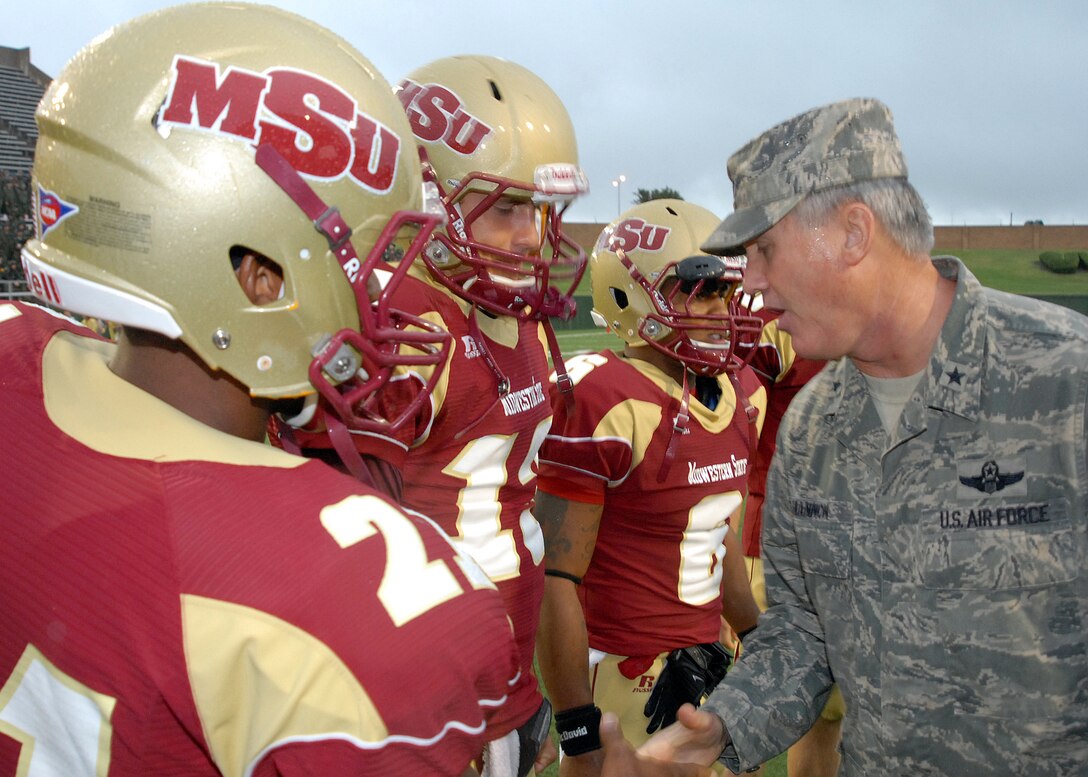 Brig. Gen. O. G. Mannon, 82nd Training Wing Commander, shakes hands with Midwestern State University football players Sept. 12 at the MSU Salute to Military football game. Every year MSU sets aside a game to honor Airmen, Soldiers, Sailors and Marines for serving. 