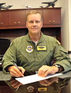 Col. Don Shaffer gives his contributions to the Combined Federal Campaign here Sept. 16. Each year, thousands of non-profit human health and welfare charities benefit  from the millions of dollars that have been given through the CFC, which is the only authorized solicitation of employees within the federal workplace. This year, donors have more than 2,500 charities to choose from. Colonel Shaffer is the 437th Airlift Wing vice commander. (U.S. Air Force photo/James M. Bowman)
