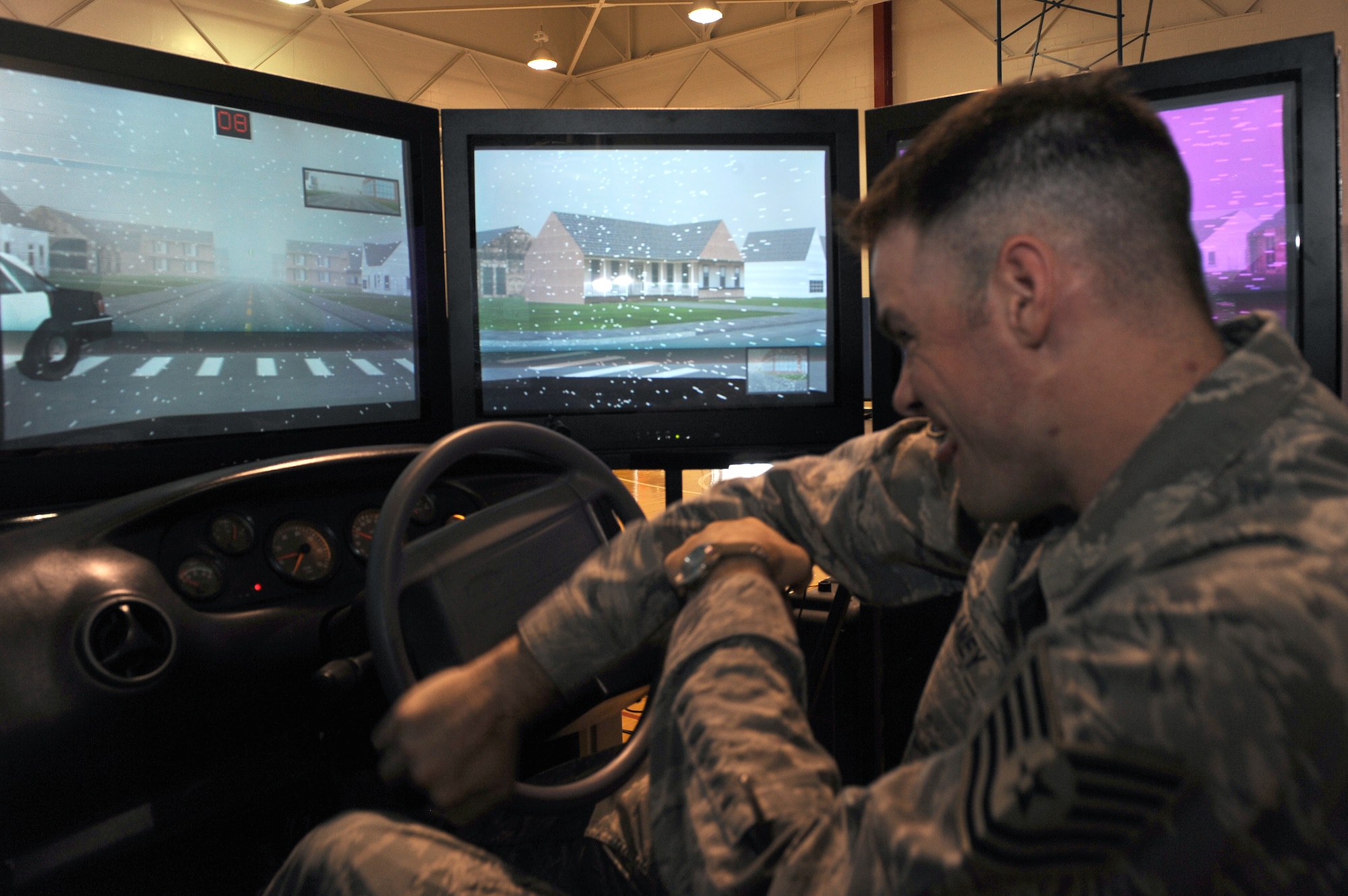 WHITEMAN AIR FORCE BASE, Mo. - Tech. Sgt. Mark Dulaney, 509th Bomb Wing safety, drives the simulator at the Save-a-Life tour, Sept. 16. The Save-a-Life tour brings in multi-million dollar drinking and driving simulators to give the participants a realistic experience of what it would be like to drink and drive. (U.S. Air Force photo/Senior Airman Cory Todd)
