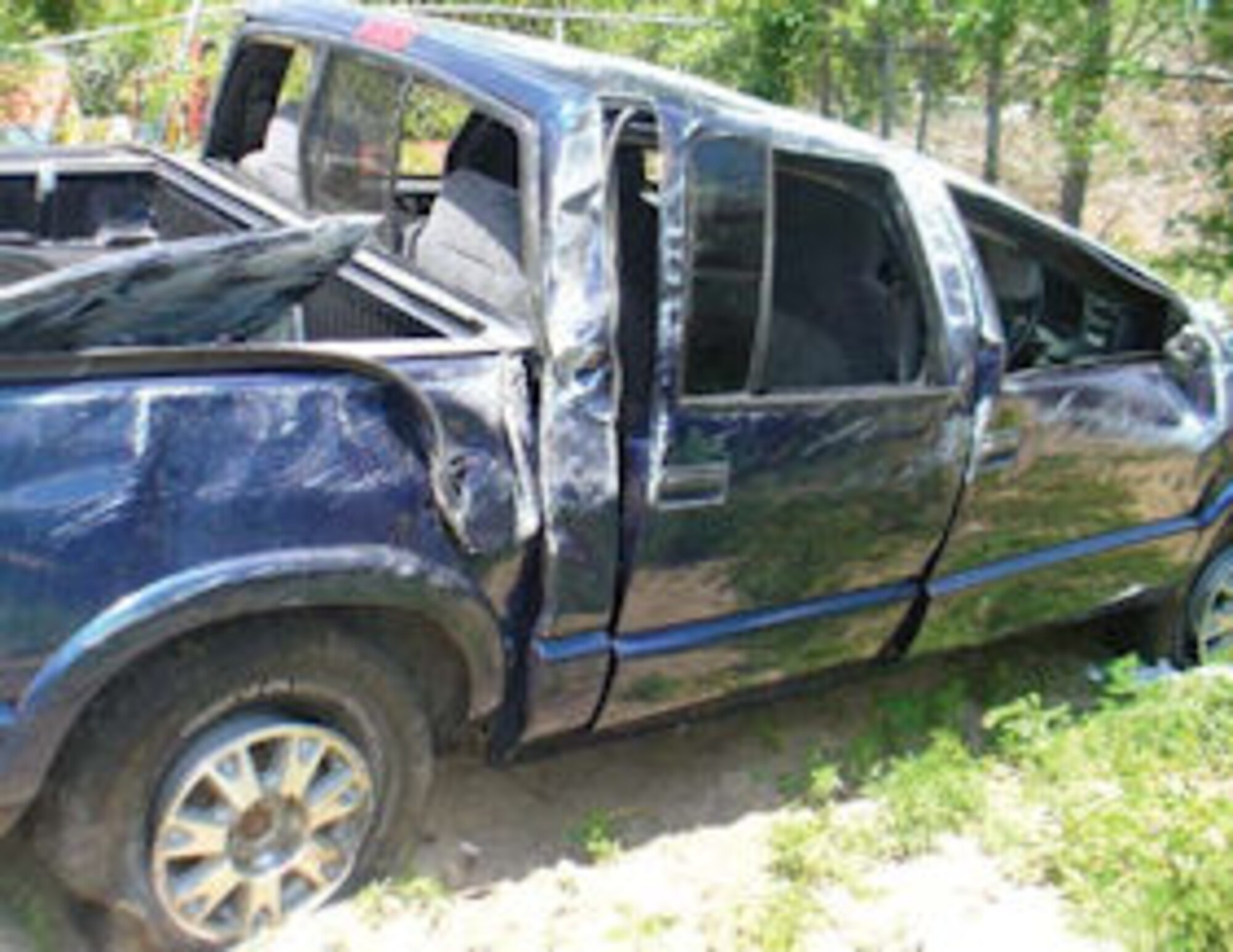 Passenger side of pickup truck after rollover
