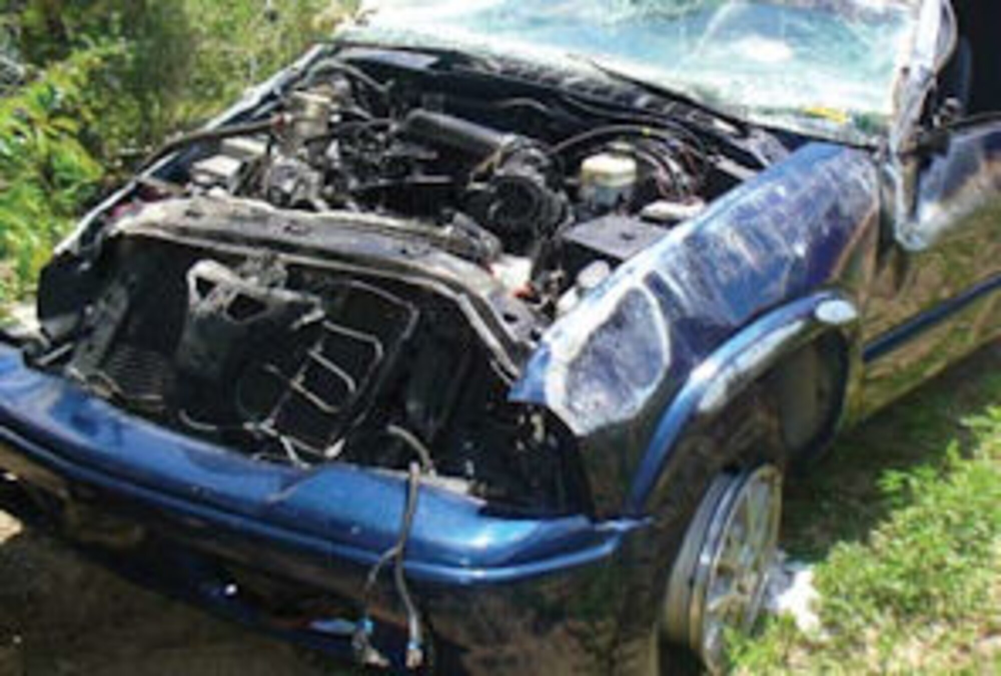 Engine compartment of pickup truck after rollover
