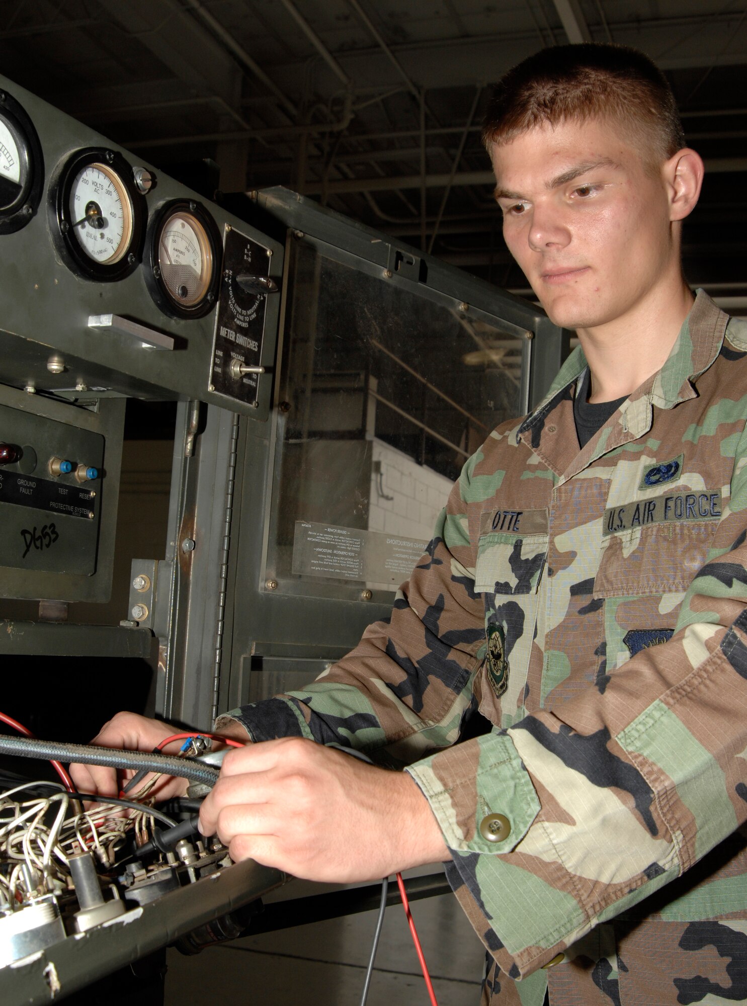 Airman 1st Class Matthew Otte, 22nd Aircraft Maintenance Squadron, troubleshoots an electrical problem on a diesel generator, Sept. 11, 2009, at McConnell Air Force Base, Kan.  The St. Genevieve, Mo., native is a mechanic in the aerospace ground equipment shop.  (U.S. Air Force photo/Senior Airman Laura Suttles)