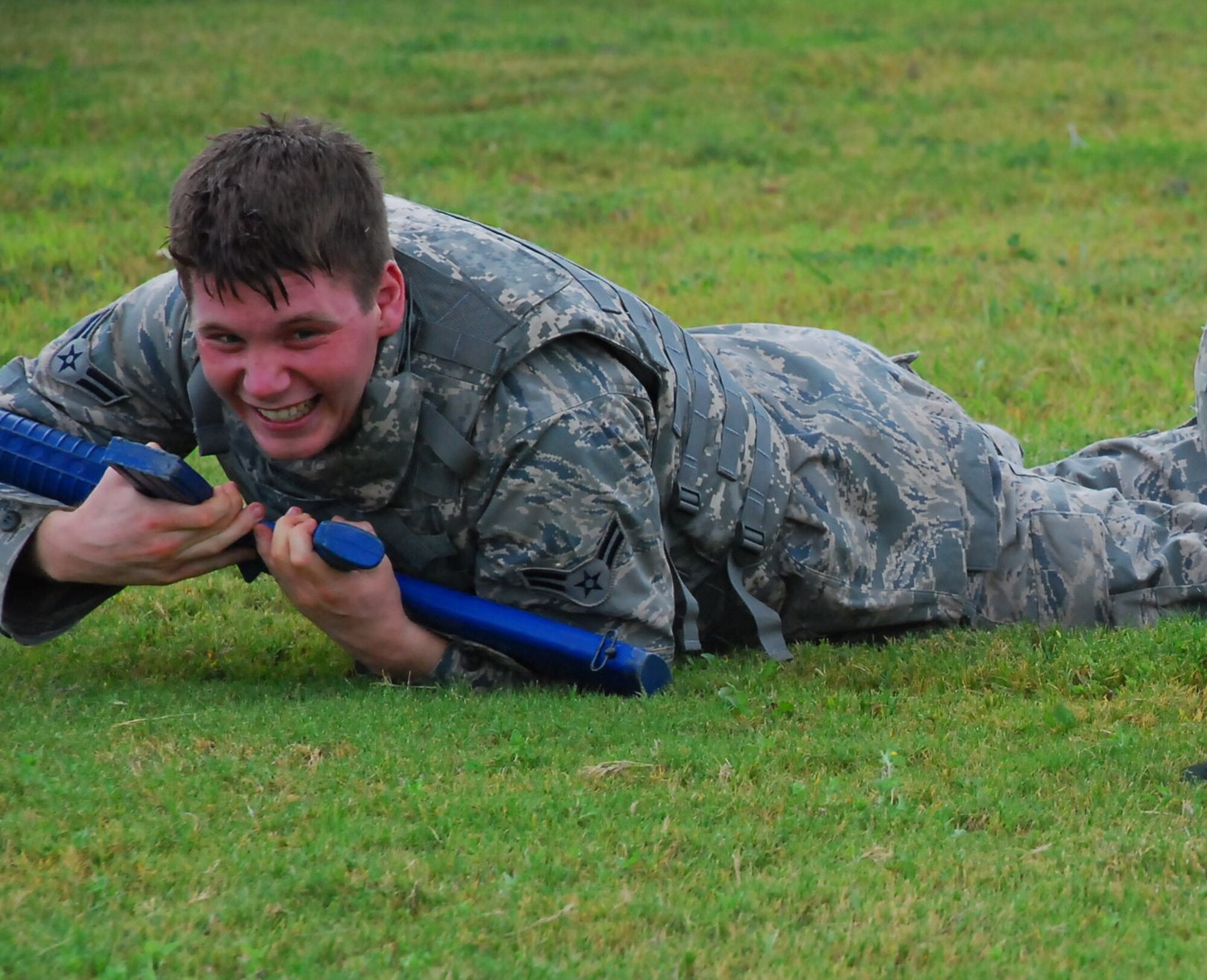 LAUGHLIN AIR FORCE BASE, Texas – Airman 1st Class Blandon Thomas, 47th Flying Training Wing, works his way across the field during high-crawl training here Sept. 8. High-crawl practice is part of the training Security Forces augmentees receive annually. (U.S. Air Force photo by 2nd Lt. Jonathan Cook)