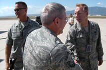 Chief Master Sgt. Joseph Westerlund (right), 302nd Airlift Wing command chief, and Capt. Collin "Bo" Shelton (left), greet inspectors from the Air Force Reserve Command Unit Compliance Inspection team Sept. 9 after their arrival to Peterson Air Force Base. The inspectors were part of the 2009 UCIs for both the 310th Space Wing, based at local Schriever AFB, and 302nd Airlift Wing. The UCIs are scheduled to run Sept. 9-21. Captain Shelton is assigned to the 302nd Aircraft Maintenance Squadron. Peterson AFB is located in Colorado Springs, Colo. Note: For security purposes, this photo has been altered. (U.S. Air Force photo/Staff Sgt. Stephen J. Collier)