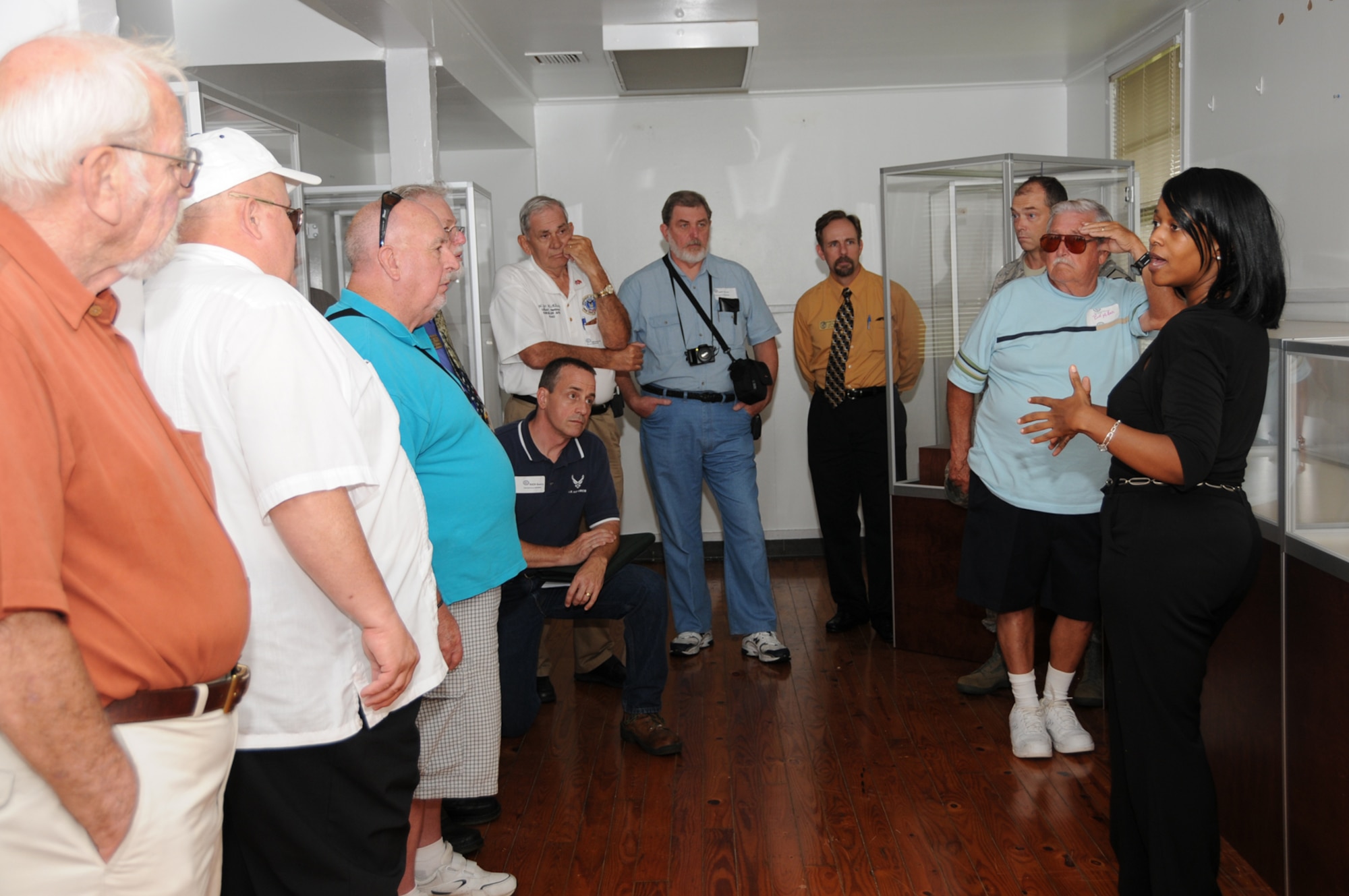 Keesler historian Tasha Hairston, right, gives a tour of the base’s heritage display to members of the Air Force Radar Sites Veterans team.  The team, which is trying to develop support for a radar museum as it visits several bases, also toured the 338th Training Squadron radar systems training equipment and the 334th TRS air traffic control radar simulators.  Werner Lamm, 338th TRS, coordinated the tour.  (U.S. Air Force photo by Kemberly Groue)