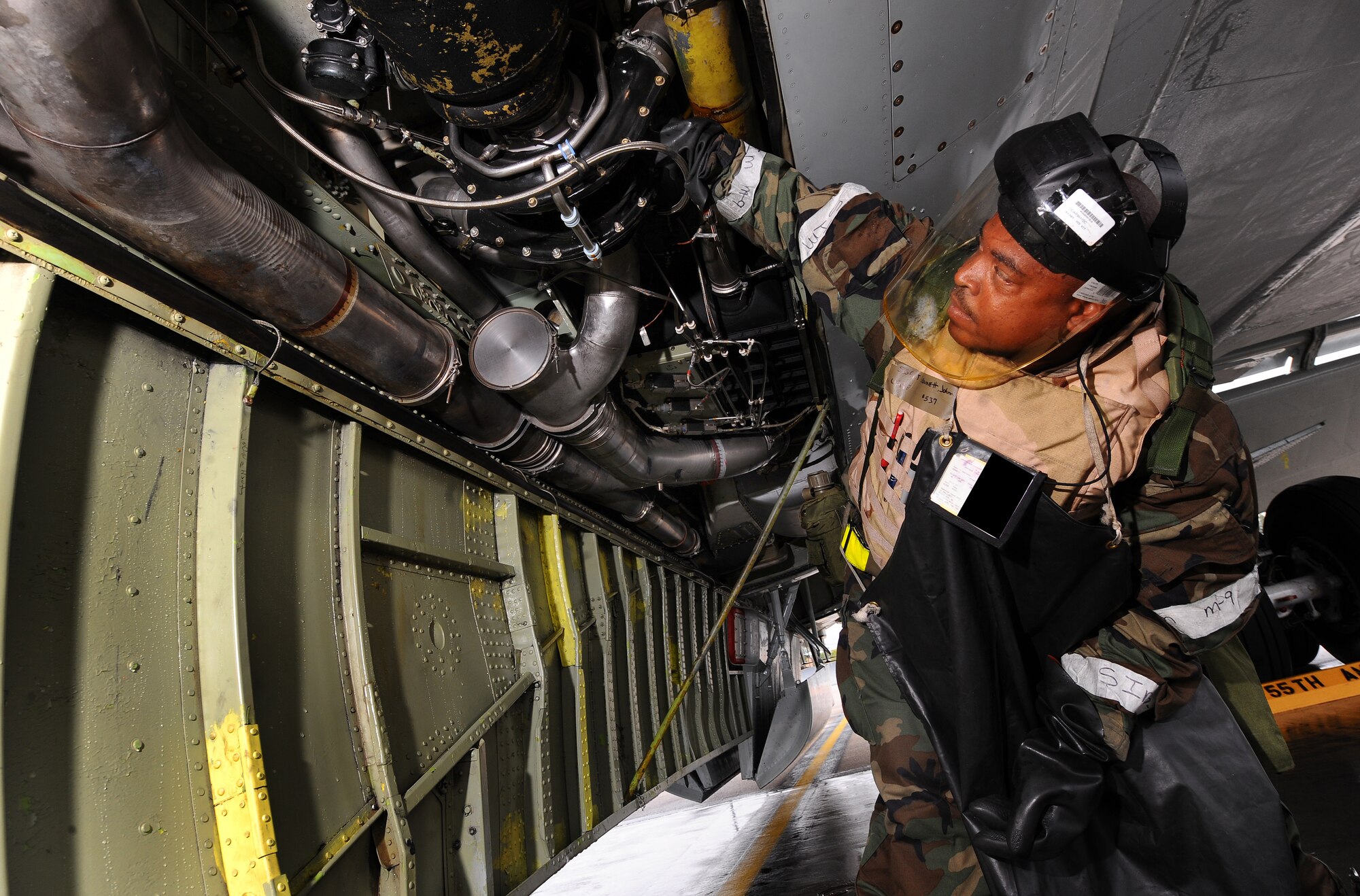 OFFUTT AIR FORCE BASE, Neb. -- Staff Sgt. Johnnie Bennett, a crew chief with the 55th Maintenance Group, lowers panels of an RC-135 V/W Rivet Joint aircraft to inspect the air conditioning system Sept. 12, as part of an Operational Readiness Inspection. The system is  used to cool the electronic equipment onboard the aircraft. The 55th Wing earned an overall "Excellent" rating from the Air Combat Command inspection team. 

U.S. Air Force Photo by Josh Plueger
