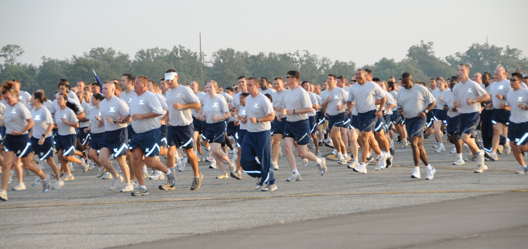 Maj. Michael Wascher plays Taps on the herald trumpet at the 9/11 retreat ceremony in front of 81st Training Wing headquarters.  Many base members braved an afternoon downpour to attend.  (U.S. Air Force photo by Kemberly Groue)