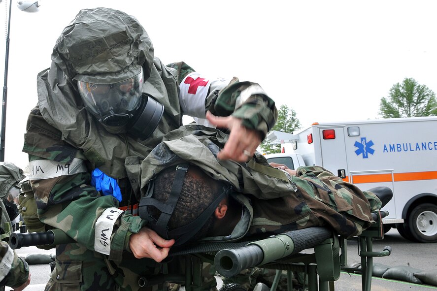 OFFUTT AIR FORCE BASE, Neb. -- Lt. Col. Toni Strong, 55th Medical Group, puts a gas mask on an injured Airman as part of an Operational Readiness Inspection scenario Sept. 12. The 55th Wing underwent this inspection to test their combat skills and ability to effectively protect a deployed base from attack. 

U.S. Air Force Photo by Charles Haymond

