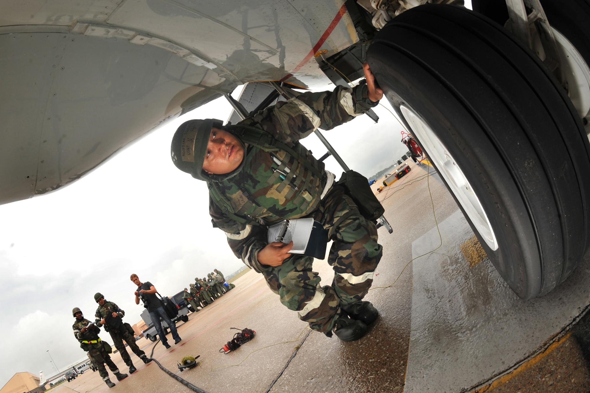 OFFUTT AIR FORCE BASE, Neb. -- Staff Sgt. Jimmy Aguilar, assistant dedicated crew chief for the 55th Maintenance Group, does a post flight inspection on a RC-135 V/W Rivet Joint aircraft Sept. 12 as part of an Operational Readiness Inspection. 

U.S. Air Force Photo by Charles Haymond
