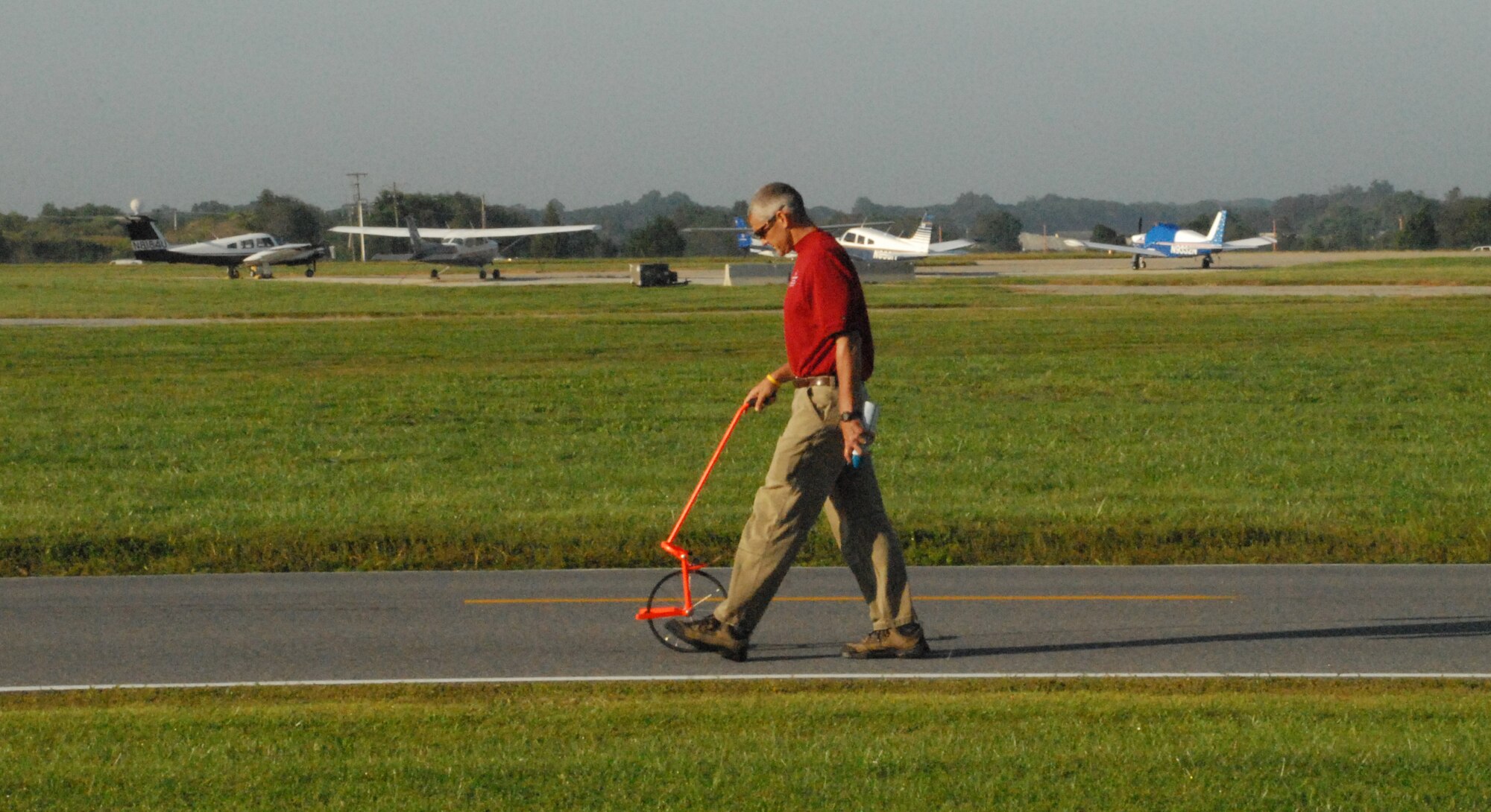 Mark Wise, Special Olympics director of sports training and volunteer management, measures out the route for a Special Olympics bicycle event being held on base at the Eagles Nest Picnic Area Sept. 18.  (U.S. Air Force photo/Staff Sgt. Chad Padgett)