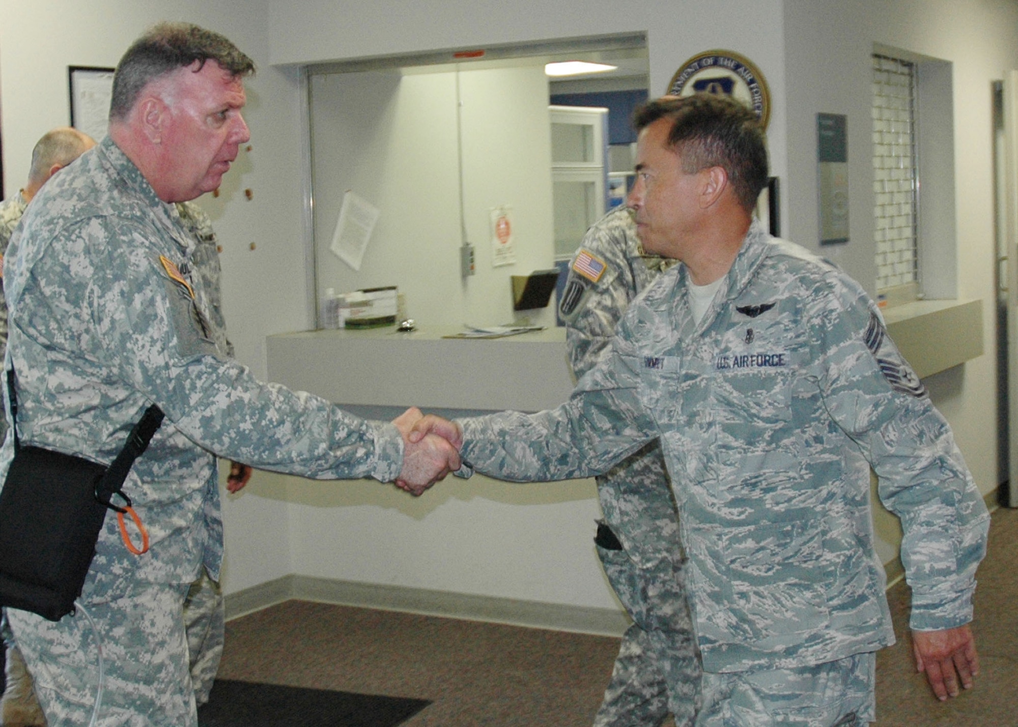 Chief Simmet, right, welcomes General Mulholland to the 919th Medical Squadron’s medical training facility Sept. 1 during the Army special operations leader’s visit to key Duke Field support sites.  (U.S. Air Force photo/Dan Neely)