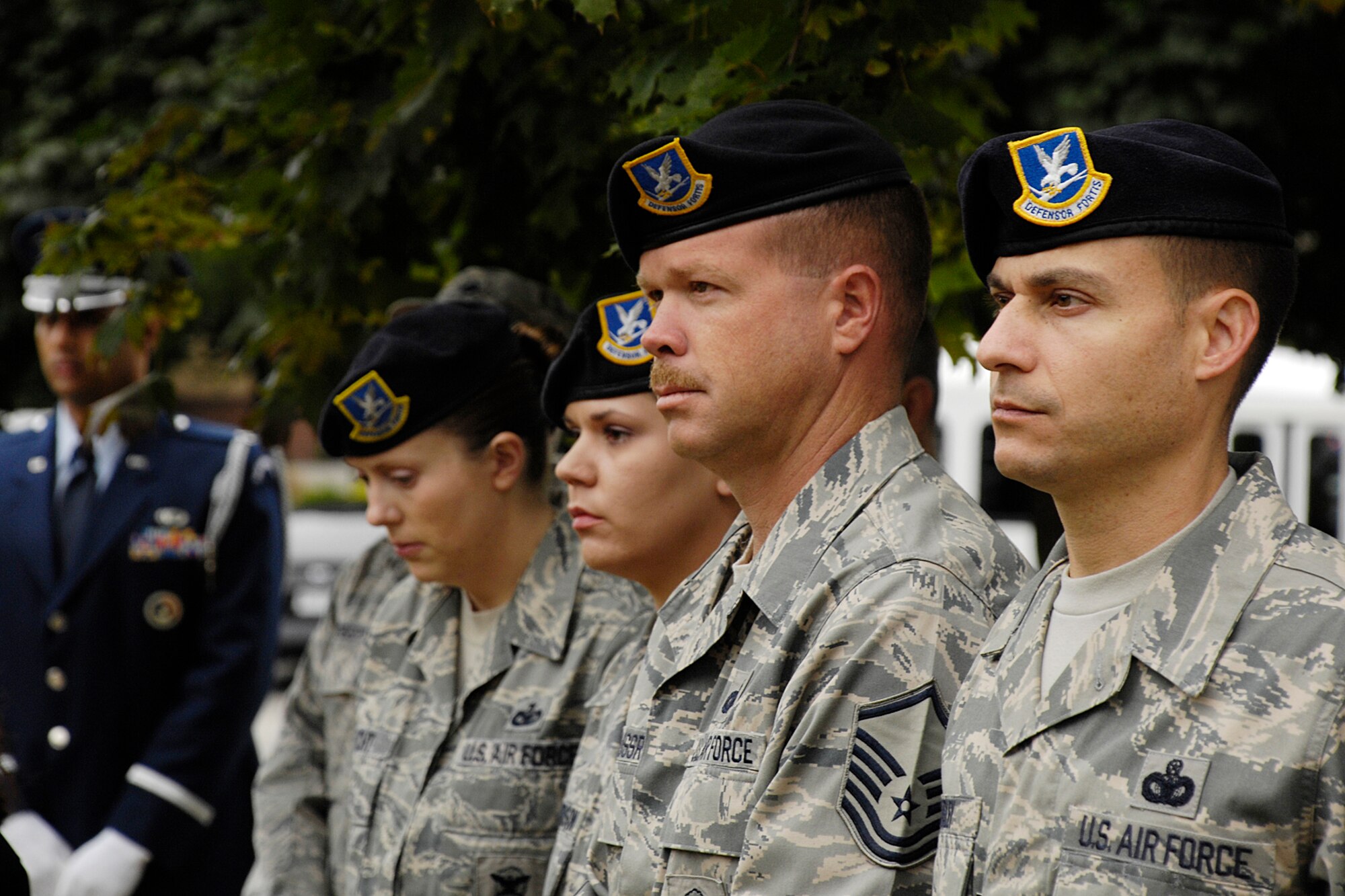HANSCOM AIR FORCE BASE, Mass. - From left, Staff Sgt. Nicole Becht, Staff Sgt. Carrieanne Richardson, Master Sgt. Dennis Kussrow and Master Sgt. Aaron Marley, all of the 66th Security Forces Squadron, observe the speakers during the Sept. 11 ceremony at Hanscom’s POW/MIA Memorial Park. (U.S. Air Force photo by Linda LaBonte Britt)