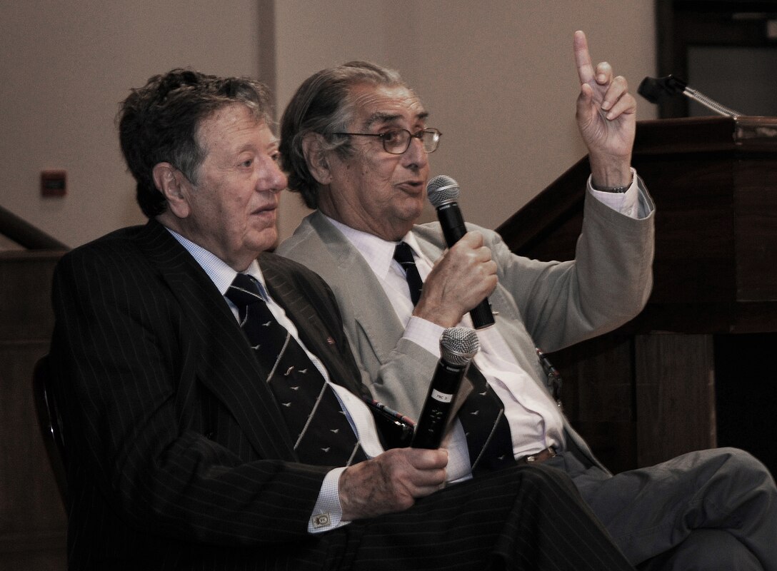RAF MILDENHALL, England -- Air Cmdr. (retired) Charles Clarke (left) and Andrew Wiseman, former prisoners of war, were two of the guest speakers at the POW/Missing in Action Remembrance Luncheon at the Galaxy Club here Sept. 16. The former Royal Air Force servicemembers told their stories about being shot down over Germany during World War II and their lives in a POW camp. (U.S. Air Force photo/Senior Airman Thomas Trower) 