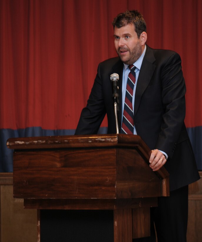 RAF MILDENHALL, England -- Dr. Howard Tuck, former Royal Air Force airman and working historian, introduces two former RAF servicemembers who were prisoners of war during World War II at the POW/Missing in Action Remembrance Luncheon at the Galaxy Club here Sept. 16. Doctor Tuck gave a brief account of war events leading up to the eventual capture of Air Cmdr. (retired) Charles Clarke (left) and Andrew Wiseman. (U.S. Air Force photo/Senior Airman Thomas Trower)