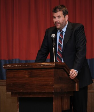 RAF MILDENHALL, England -- Dr. Howard Tuck, former Royal Air Force airman and working historian, introduces two former RAF servicemembers who were prisoners of war during World War II at the POW/Missing in Action Remembrance Luncheon at the Galaxy Club here Sept. 16. Doctor Tuck gave a brief account of war events leading up to the eventual capture of Air Cmdr. (retired) Charles Clarke (left) and Andrew Wiseman. (U.S. Air Force photo/Senior Airman Thomas Trower)