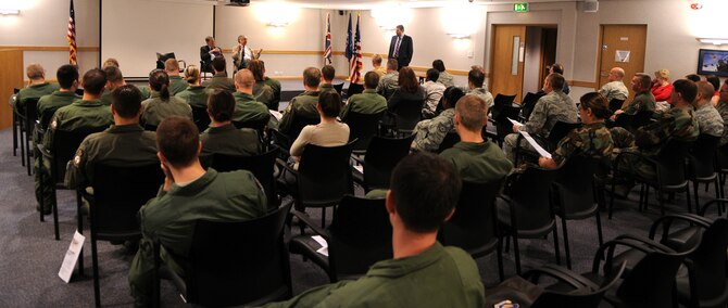 RAF MILDENHALL, England -- A crowd of about 50 Airmen listen as two former Royal Air Force airmen recount their experiences as POWs in WWII Sept. 19.  The pair were both interred at Stalug Luft III, the German POW camp featured in the movie "The Great Escape."  They visited the base to speak as part of RAF Mildenhall's POW/MIA Remembrance Week.  (U.S. Air Force photo/Staff Sgt. Austin M. May)