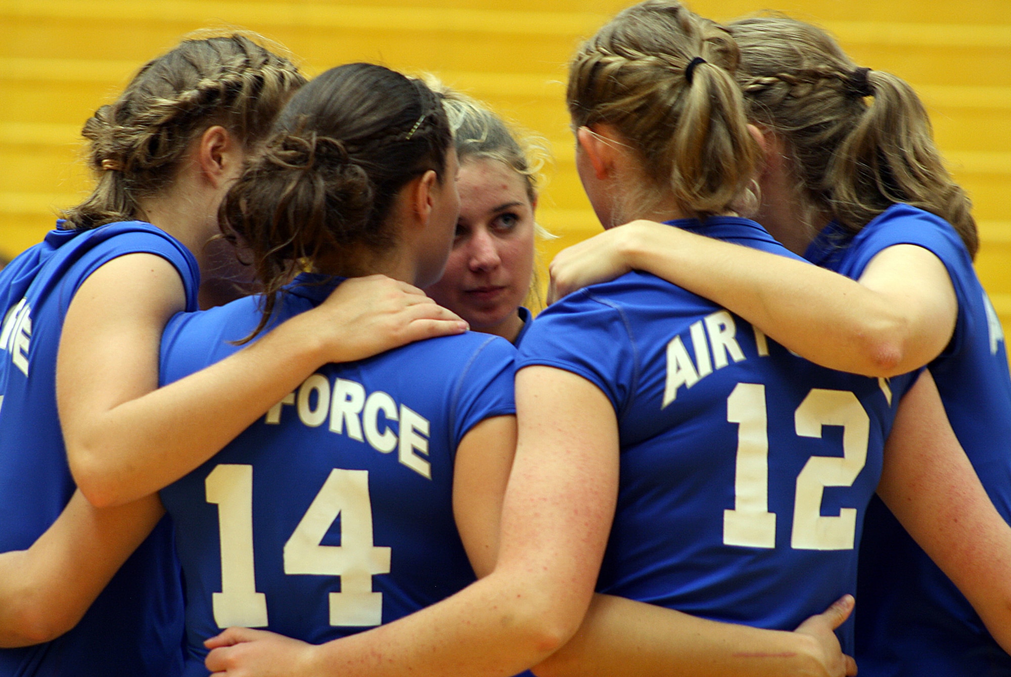 Air Force volleyball team members huddle during a match at a tournament in Denver Sept. 4. Air Force's 5-3 season start is the team's best opening series since 2003. (U.S. Air Force photo)