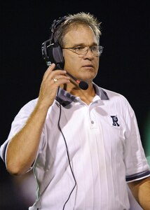 Ro-Hawks head football coach Pete Wesp listens to advice from the press box during third quarter of the Ro-Hawks first home game Friday September 11, 2009. (U.S. Air Force photo/Steve Thurow)