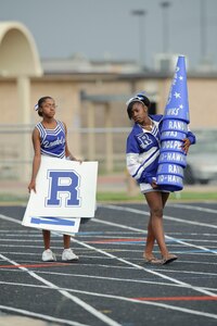 Junior Varsity cheerleaders Brittnay Johnson and Natasha Atkins prepare to get the crowd cheering at the Ro-Hawks first home game Friday September 11, 2009. (U.S. Air Force photo/Steve Thurow)