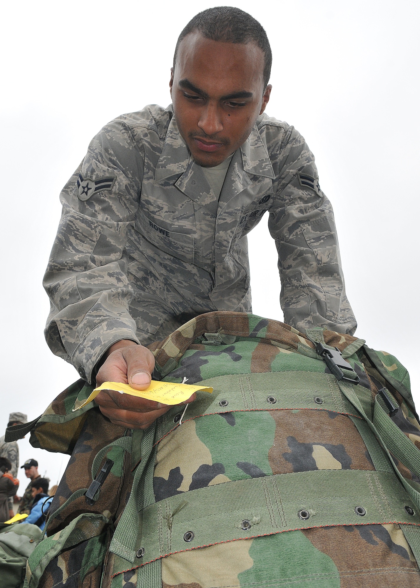 SPANGDAHELM AIR BASE, Germany – Airman 1st Class Desmond Rowe, checks baggage tags to find his rucksack after returning from a four-month deployment to Kandahar, Afghanistan, Sept. 16.  About 60 members of the 606th ACS operated radar and communication for command and control for the 71st Expeditionary Air Control Squadron.  The unit also deployed 300 short tons of equipment to support air battle management operations and more than 13,000 sorties.  Approximately 30 other 606th ACS members also returned from a four-month deployment to southwest Asia in support of the 73rd EACS.  (U.S. Air Force photo/Airman 1st Class Nick Wilson)