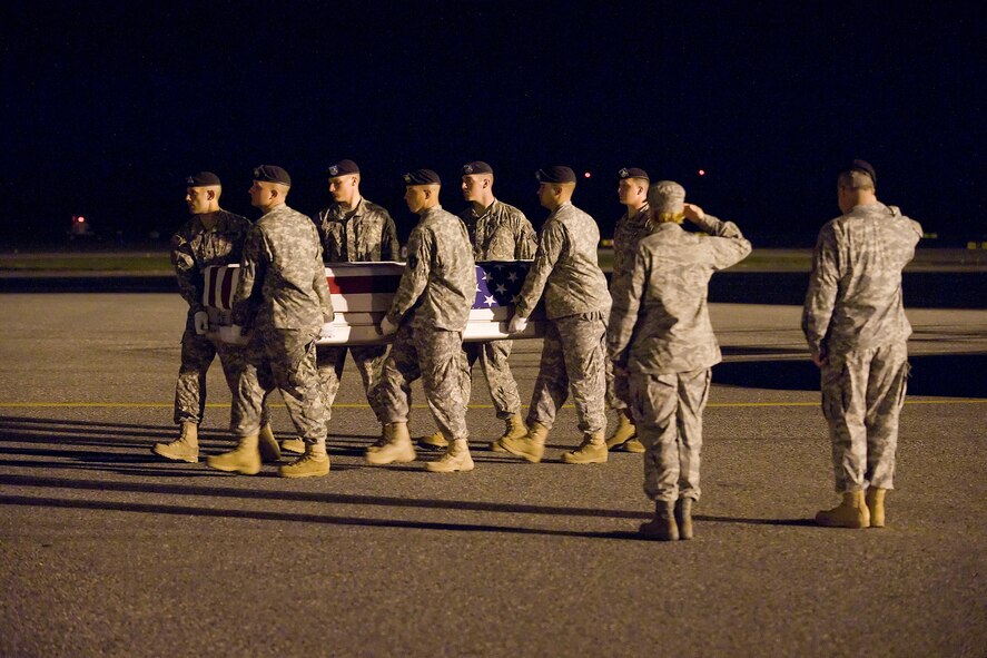 An Army carry team transfers the remains of Army Spc. Jordan M. Shay, of Salisbury, Mass., at Dover Air Force Base, Del., Sept. 6. Specialist Shay was assigned to the 5th Battalion, 20th Infantry Regiment, 3rd Stryker Brigade Combat Team, 2nd Infantry Division, Fort Lewis, Wash.  (U.S. Air Force photo/Tom Randle)