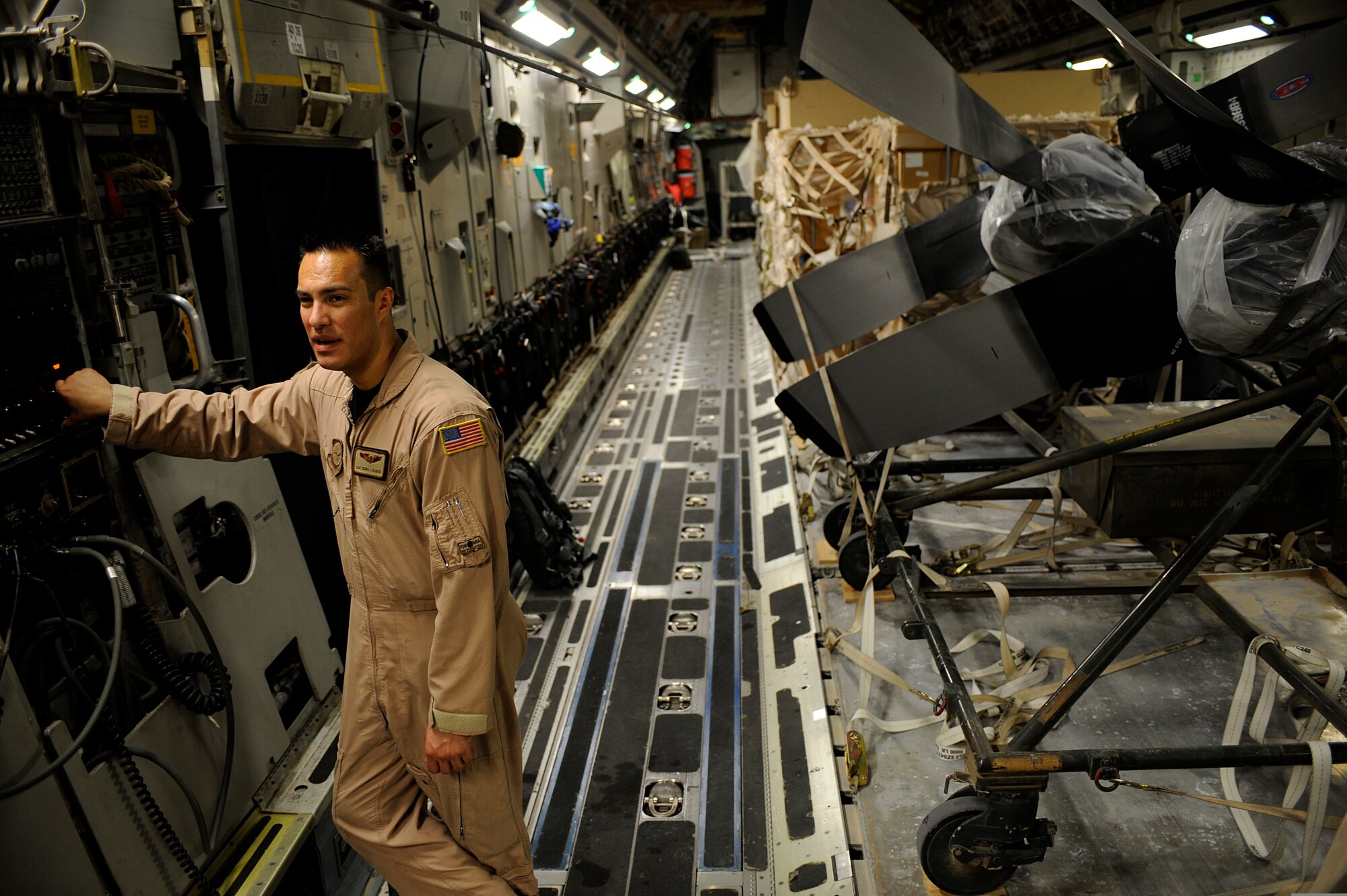 Staff Sgt. Jeramia Valentine, a loadmaster assigned to the 816th Airlift Squadron, configures the ramp of a C-17 Globemaster III aircraft at Bagram Airfield, Afghanistan, on Sept. 2, 2009, prior to the plane taking off for an airdrop mission over southern Afghanistan. (U.S. Air Force Photo/Staff Sgt. Shawn Weismiller)