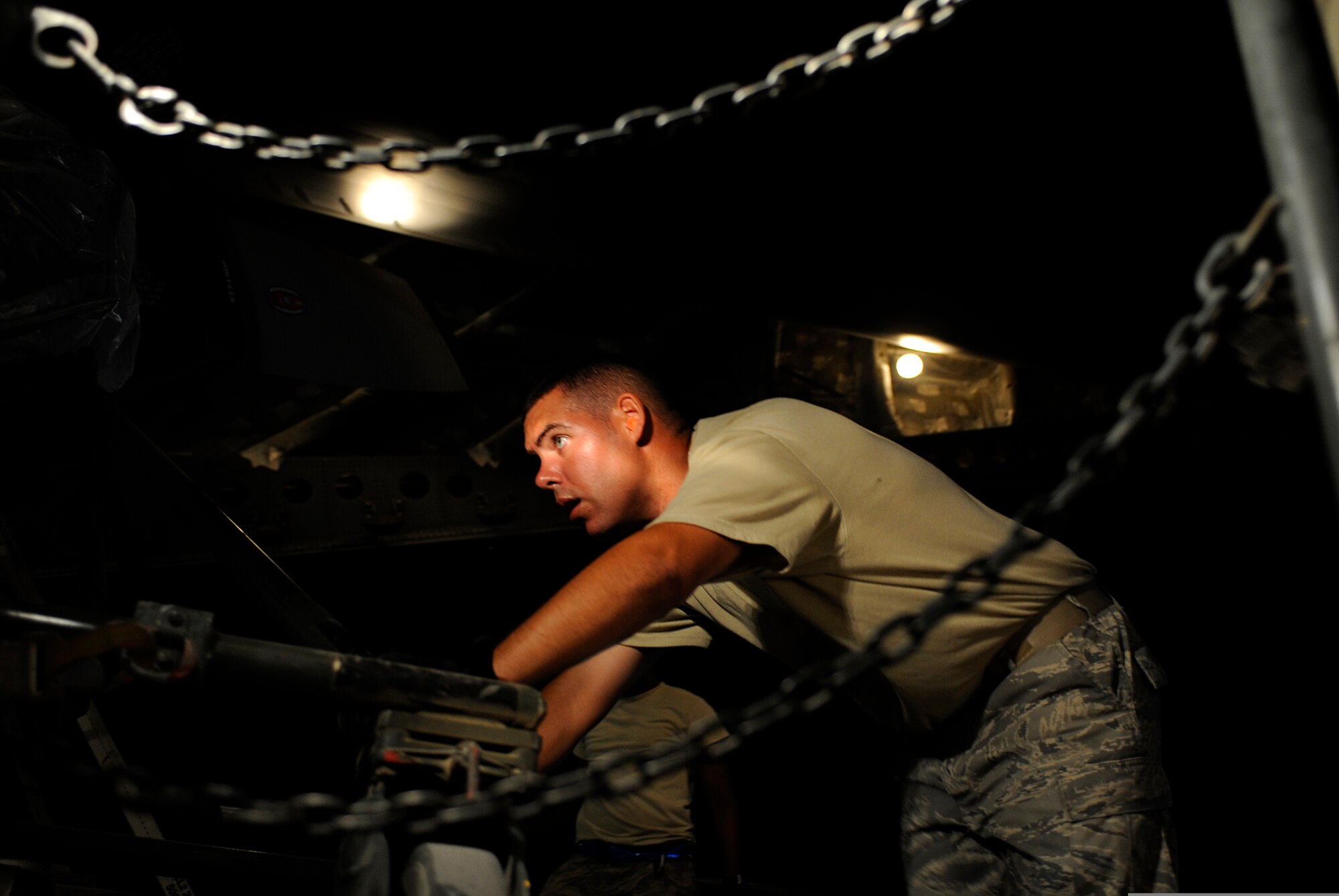 An Airman loads a pallet into the cargo bay of a C-17 Globemaster III aircraft on Sept. 2, 2009, at Bagram Air Field in Afghanistan. The pallet will be airdropped over the southern region of Afghanistan to provide needed supplies to ground personnel. (U.S. Air Force Photo/Staff Sgt. Shawn Weismiller)