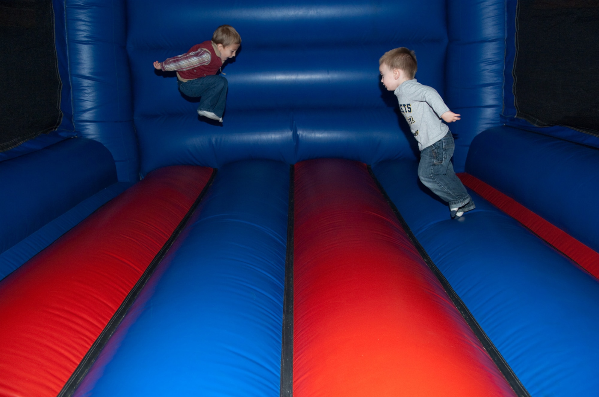 HANSCOM AIR FORCE BASE, Mass. – Evan Wilkinson (left), and Spencer Maletzke (right), take a turn in the bounce castle during the 66th Force Support Squadron’s annual Boys & Girls Club Day for Kids on Sept. 12 at the Youth Center. The event included games, activities and food. For more information on Youth Center activities call 781-377-3739 or go online to www.hanscomservices.com. (U.S. Air Force photo by Rick Berry)