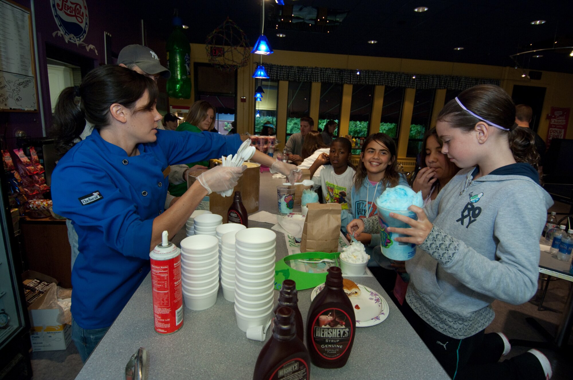 HANSCOM AIR FORCE BASE, Mass. – The 66th Force Support Squadron’s Youth Center hosted the annual Boys & Girls Club Day for Kids on Sept. 12. Shown here Hanscom youth enjoy some sweet treats with friends at the ice cream sundae bar. (U.S. Air Force photo by Rick Berry)