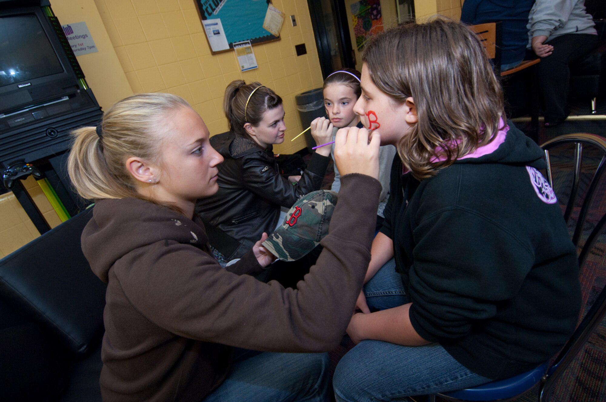 HANSCOM AIR FORCE BASE, Mass. – Erica Barnhart (left) paints Tyler Mack’s face during the during the 66th Force Support Squadron’s annual Boys & Girls Club Day for Kids on Sept. 12 at the Youth Center. The event included games, activities and food. For more information on Youth Center activities call 781-377-3739 or go online to www.hanscomservices.com. (U.S. Air Force photo by Rick Berry)