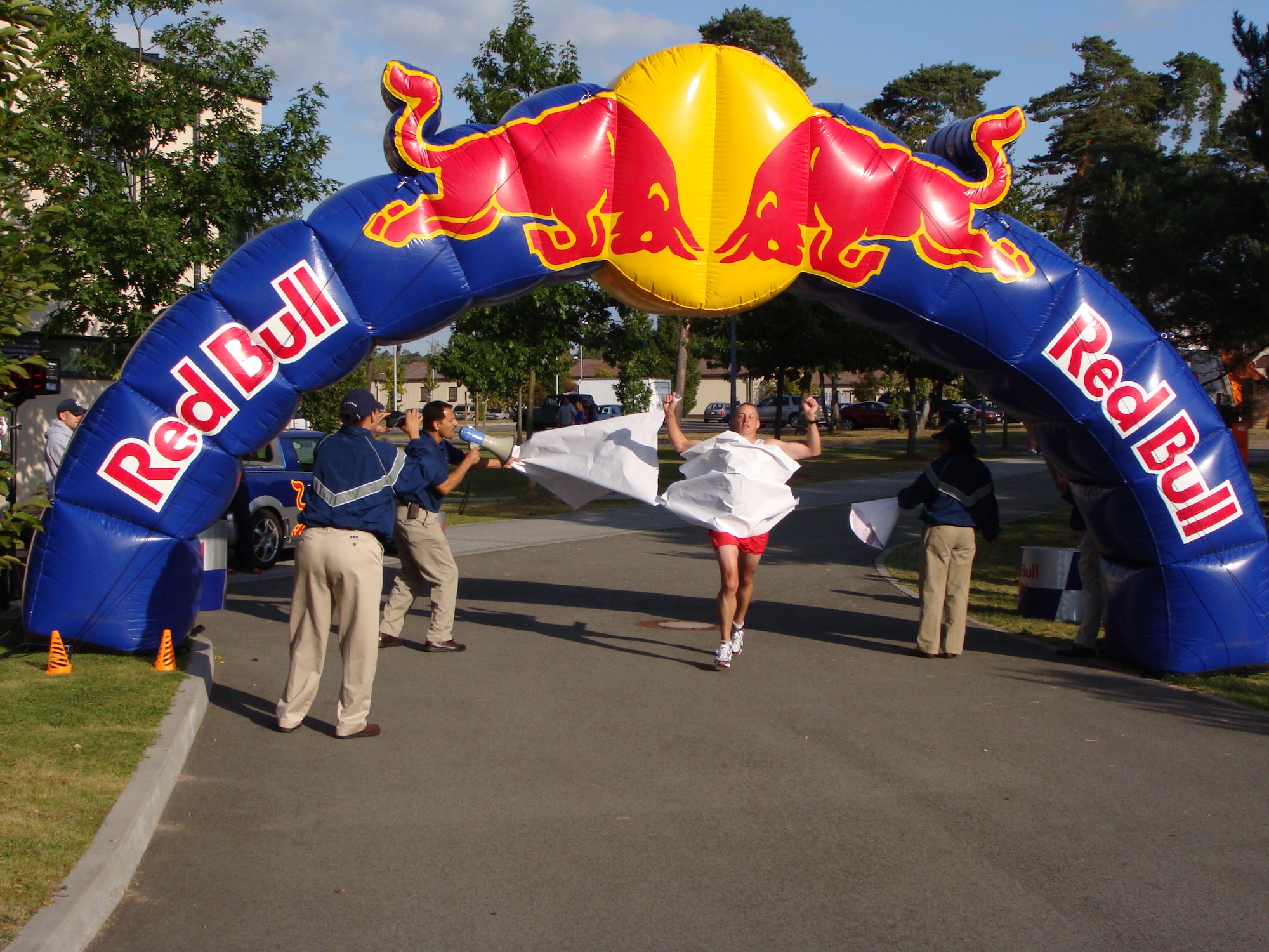 Bill Rediske, Landstuhl Regional Medical Center podiatrist, crosses the finish line in first place during the first ever Kaiserslautern Military Community Half Marathon, Ramstein Air Base, Germany, Sept. 12, 2009. Rediske ran the 13.1-mile trek in 1:20:43. (U.S. Air Force photo by Senior Master Sgt. Jeffrey Fletcher)