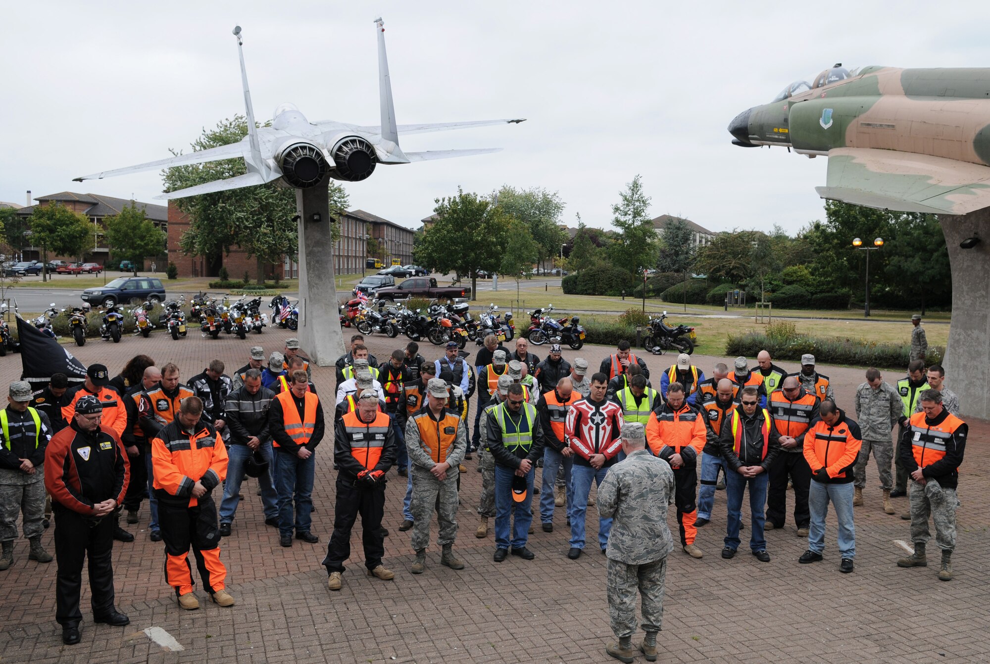 RAF MILDENHALL, England -- Chaplain (Capt.) Richard Holmes, 48th Fighter Wing chapel, speaks to more than 50 riders of the "Rolling Thunder" motorcycle memorial ride Sept. 15 at RAF Lakenheath's Memorial Park by the 'Lest we Forget' wall. (U.S. Air Force photo/Senior Airman Thomas Trower) 