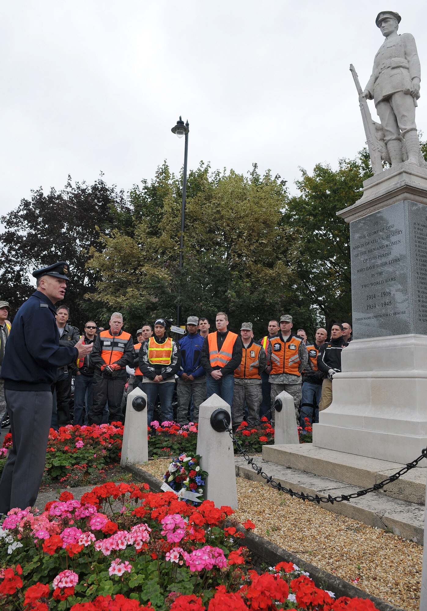 RAF MILDENHALL, England -- Squadron Leader Rick Fryer, RAF Mildenhall station commander, gives a speech at a wreath-laying ceremony in front of the British war memorial in the town of Mildenhall Sept. 15. This was one of four stops along the route of this year's "Rolling Thunder" memorial ride. The ride was for Prisoner of War/Missing in Action remembrance week. (U.S. Air Force photo/Senior Airman Thomas Trower)