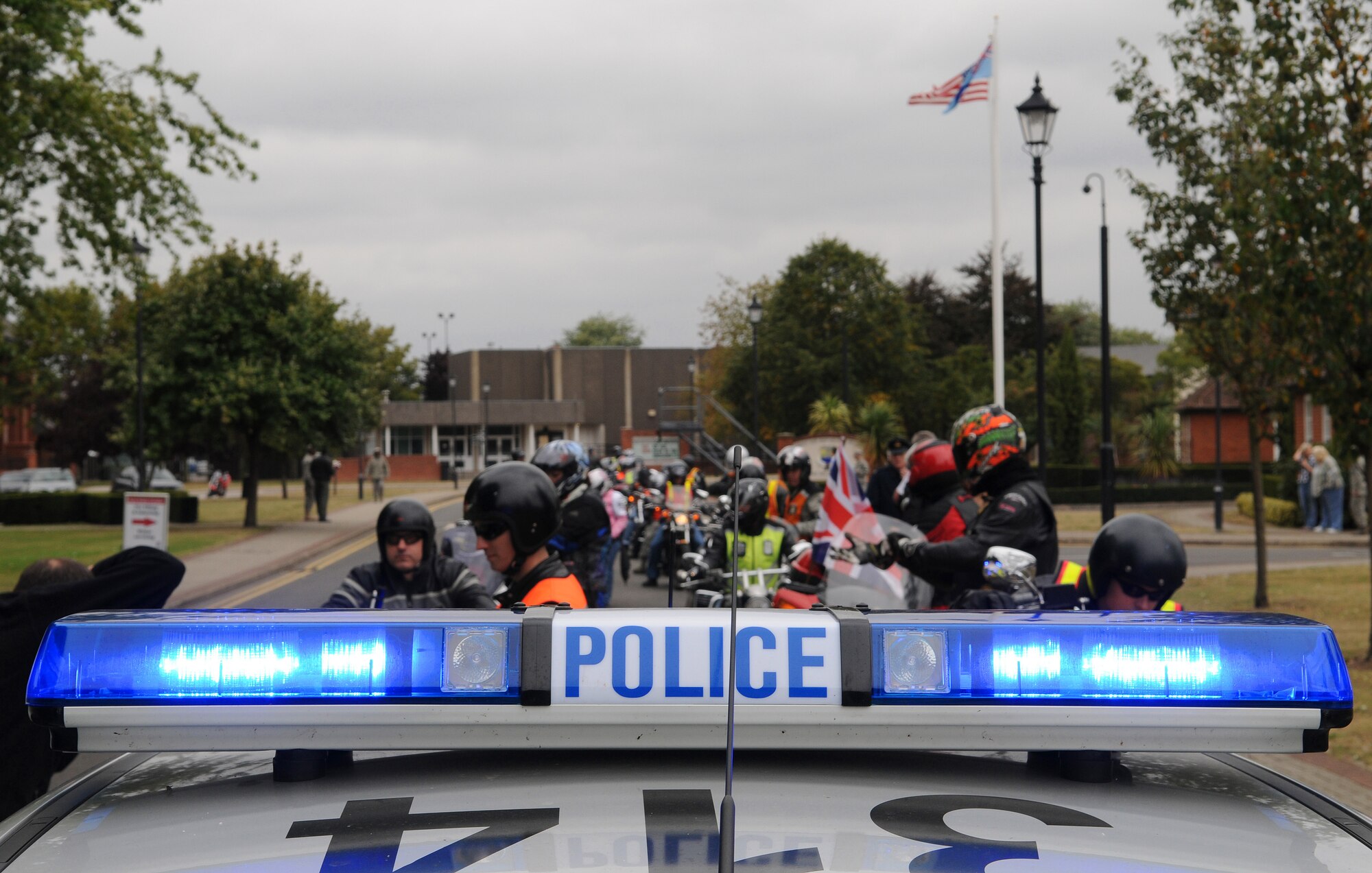 RAF MILDENHALL, England -- More than 50 motocyclists rev their engines to proceed to their next stop along the "Rolling Thunder" memorial ride at RAF Mildenhall Sept. 15. Riders received a police escort for the route in observance of Prisoner of War/Missing in Action remembrance week. Security Forces personnel let the line on RAFs Mildenhall and Lakenheath, while Ministry of Defence constabulary led the formation through the town of Mildenhall and Lakenheath village. (U.S. Air Force photo/Senior Airman Thomas Trower)