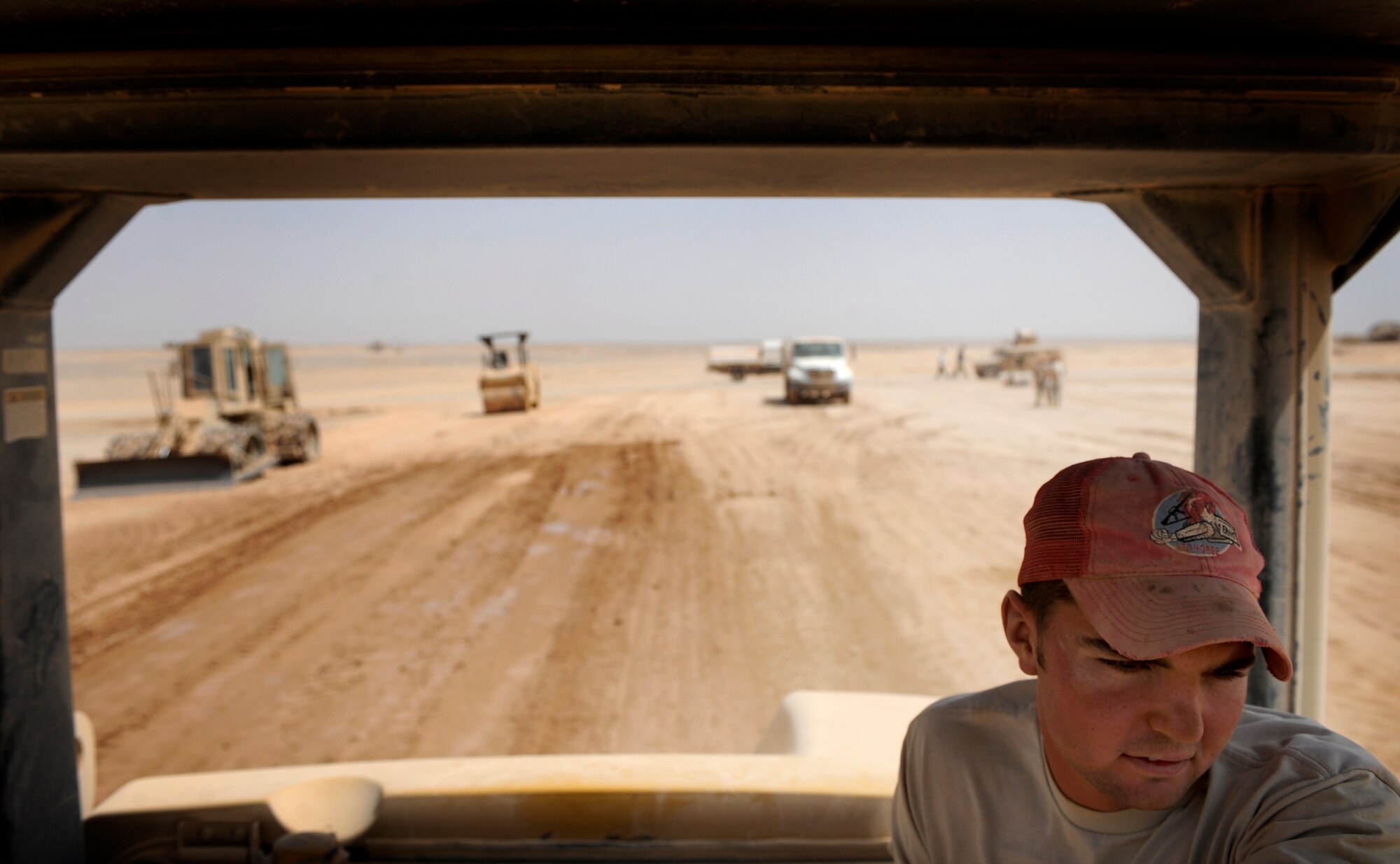 Airman First Class Nathanial Dilling, assigned to the 809th Expeditionary Red Horse Squadron, 1st Expeditionary Red Horse Group, operates a roller Sept. 9, Forward Operating Base Dwyer, Afghanistan. The roller is used to prepare the ground for a paved Airfield project that will allow C-17 Globemaster III's to land at FOB Dwyer. Airman Dilling is deployed from the 819th Red Horse Squadron, Malmstrom, AFB, MT (U.S. Air Force Photo/Staff Sgt. Shawn Weismiller)