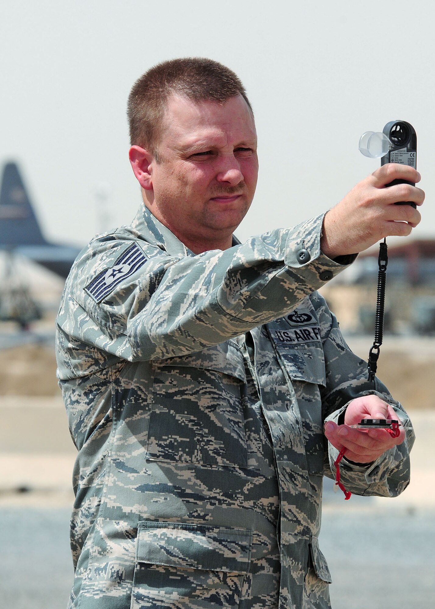 SOUTHWEST ASIA -- Tech. Sgt. Richard Stage, 386th Expeditionary Operations Support Squadron weather forecaster, uses a Kestrel 4000 hand held pocket weather tracker to check the temperature, relative humidity, and wind speed at an undisclosed location in Southwest Asia Sept. 15, 2009.  Sergeant Stage is deployed from the 62nd Airlift Wing, McChord Air Force Base, Wash., and hails from Elmira, N.Y.  (U.S. Air Force photo/Tech. Sgt. Tony Tolley)