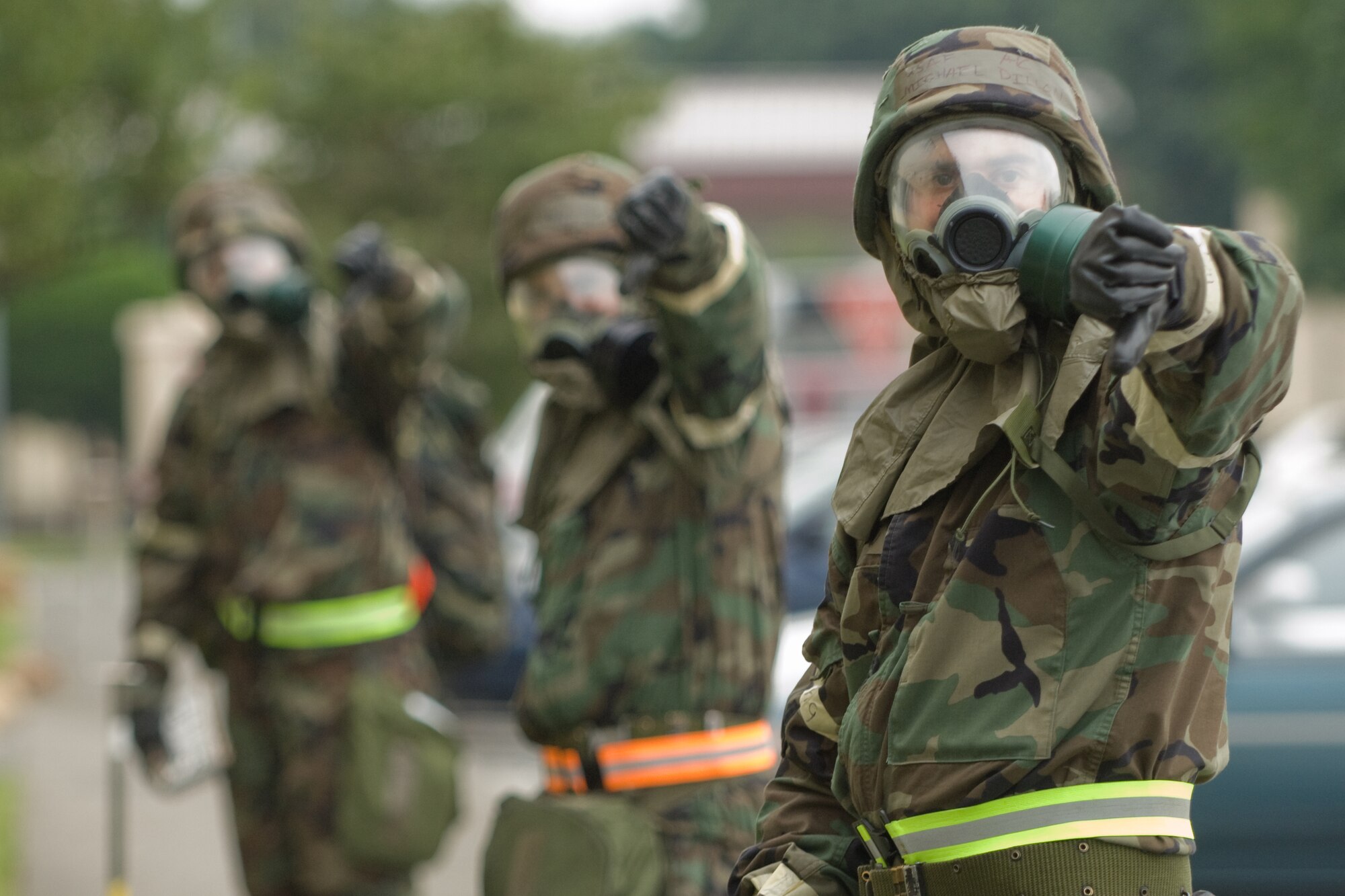 YOKOTA AIR BASE, Japan -- Airmen from the 374th Airlift Wing staff agencies post attack reconnaissance team delivers the thumbs-down hand signal to indicate contamination is present during Ability to Survive and Operate training recently. ATSO knowledge will be an area of emphasis during the wing's upcoming Operational Readiness Inspection. (U.S. Air Force photo/Osakabe Yasuo)
 