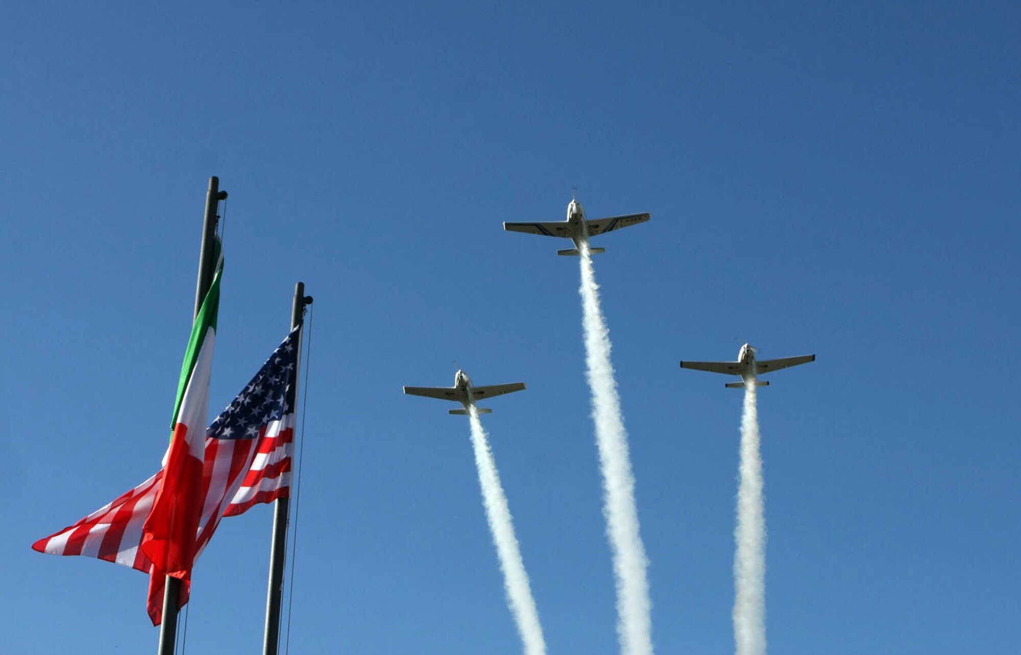 The Aero club of Pordenone flys overhead the 8th Annual Italian-American Friendship Festival held in Roveredo, Italy, Sept. 5, 2009.  The annual festival allowed American participants stationed at Aviano Air Base to meet and socialize with their Italian hosts while learning more about Italy's history and culture and sampling local cuisine.  (Courtesy photo/Michele Missinato)