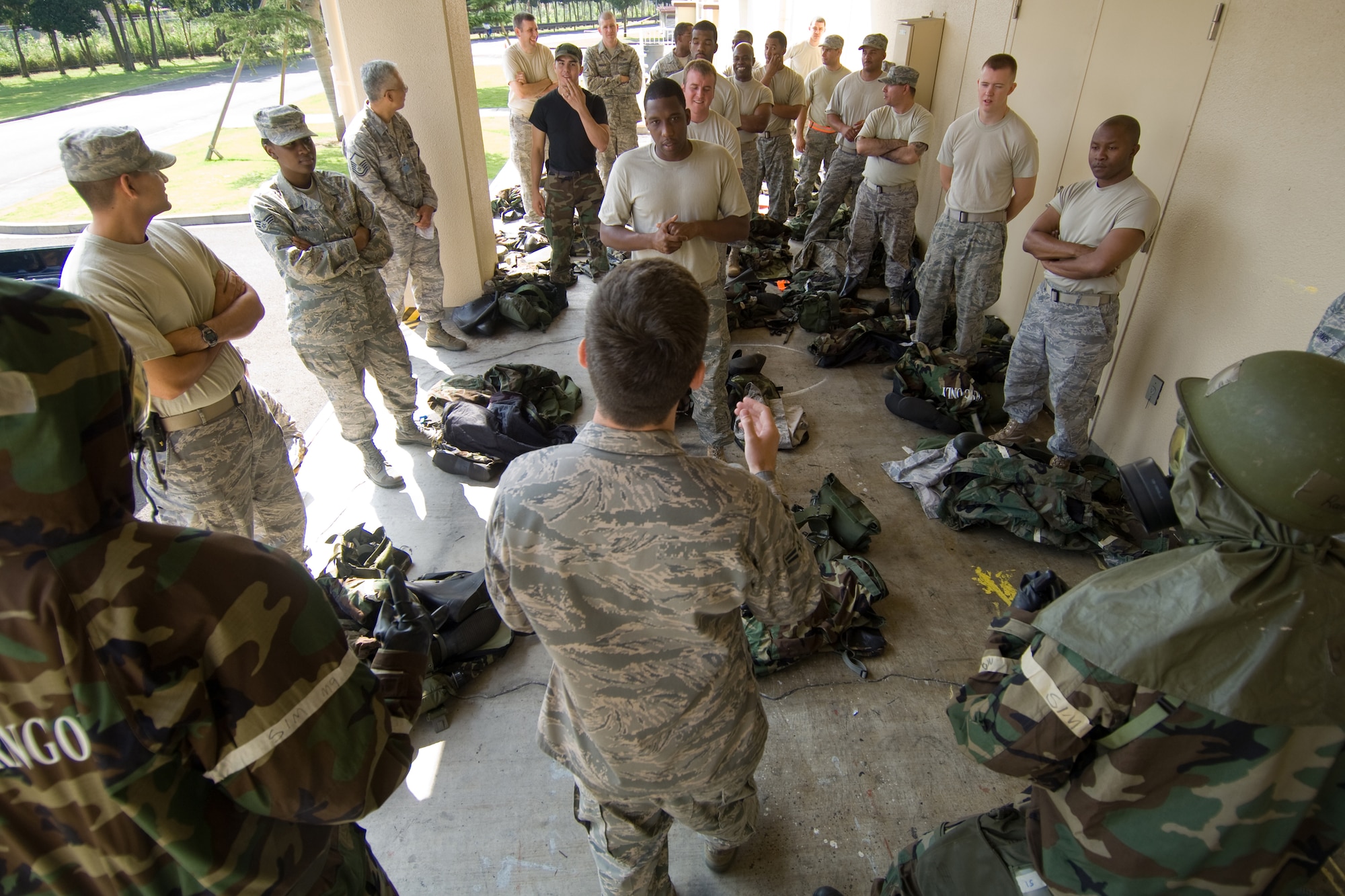 YOKOTA AIR BASE, Japan -- Airmen from throughout the base took part in an Ability to Survive and Operate Rodeo recently at the Taiyo Community Center. The rodeo included refresher training on proper chemical protective overgarment wear, contamination avoidance procedures, unexploded ordnance marking, self-aide, buddy care techniques and more. ATSO knowledge will be an area of emphasis during the wing's upcoming Operational Readiness Inspection. (U.S. Air Force photo/Osakabe Yasuo) 