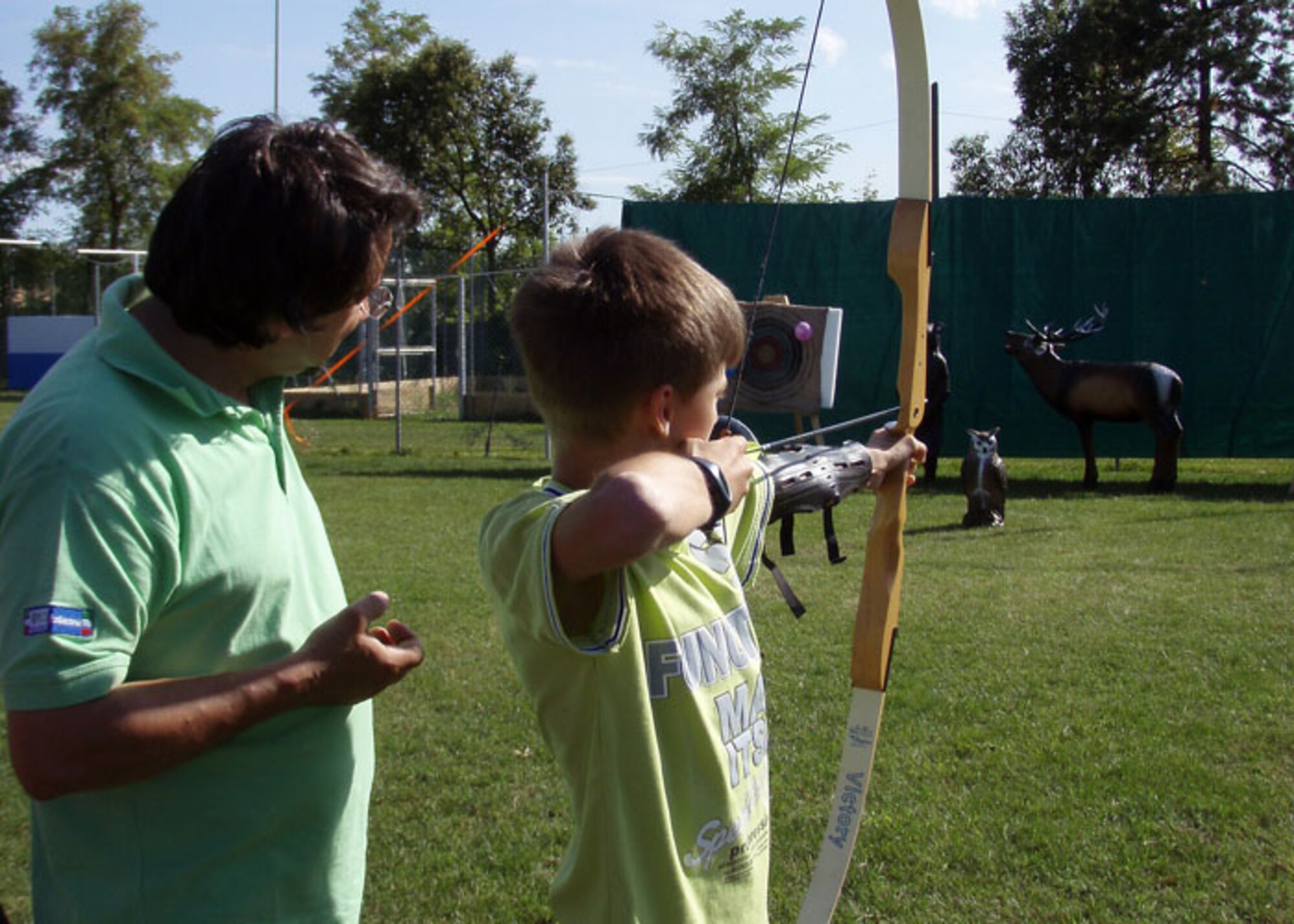 Italian and American children and adults received hands-on instruction on form and technique in properly using a bow and arrow to hit a target during the 8th Annual Italian-American Friendship Festival held in Roveredo, Italy, Sept. 5, 2009.  The annual festival allowed American participants stationed at Aviano Air Base to meet and socialize with their Italian hosts while learning more about Italy's history and culture and sampling local cuisine.  (Courtesy photo/Agnes Cronin)
