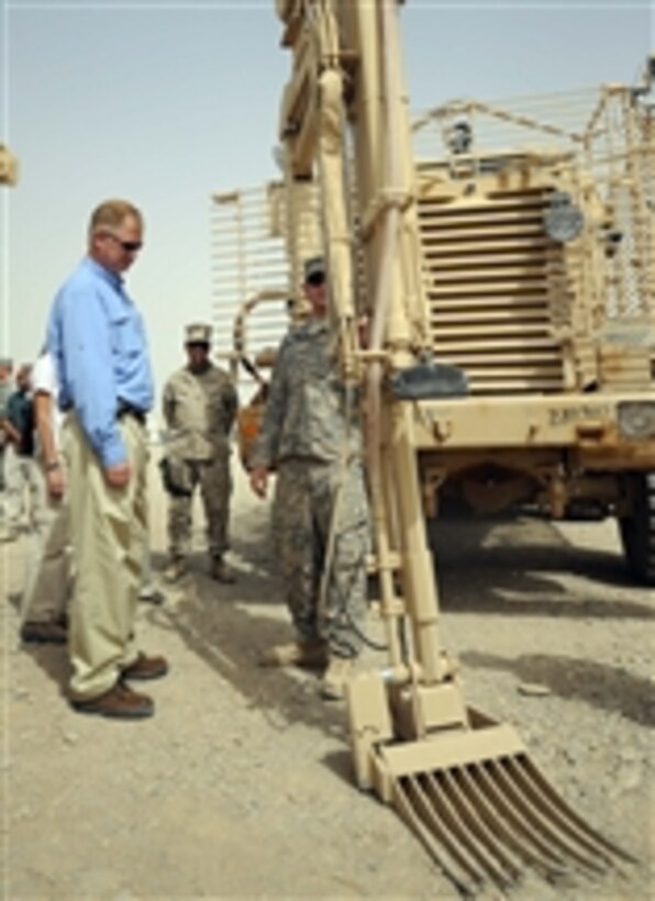 Deputy Secretary of Defense William J. Lynn III receives a tour of Mine Resistant Ambush Protected vehicles at Camp Leatherneck, Afghanistan, on Sept.10, 2009.  