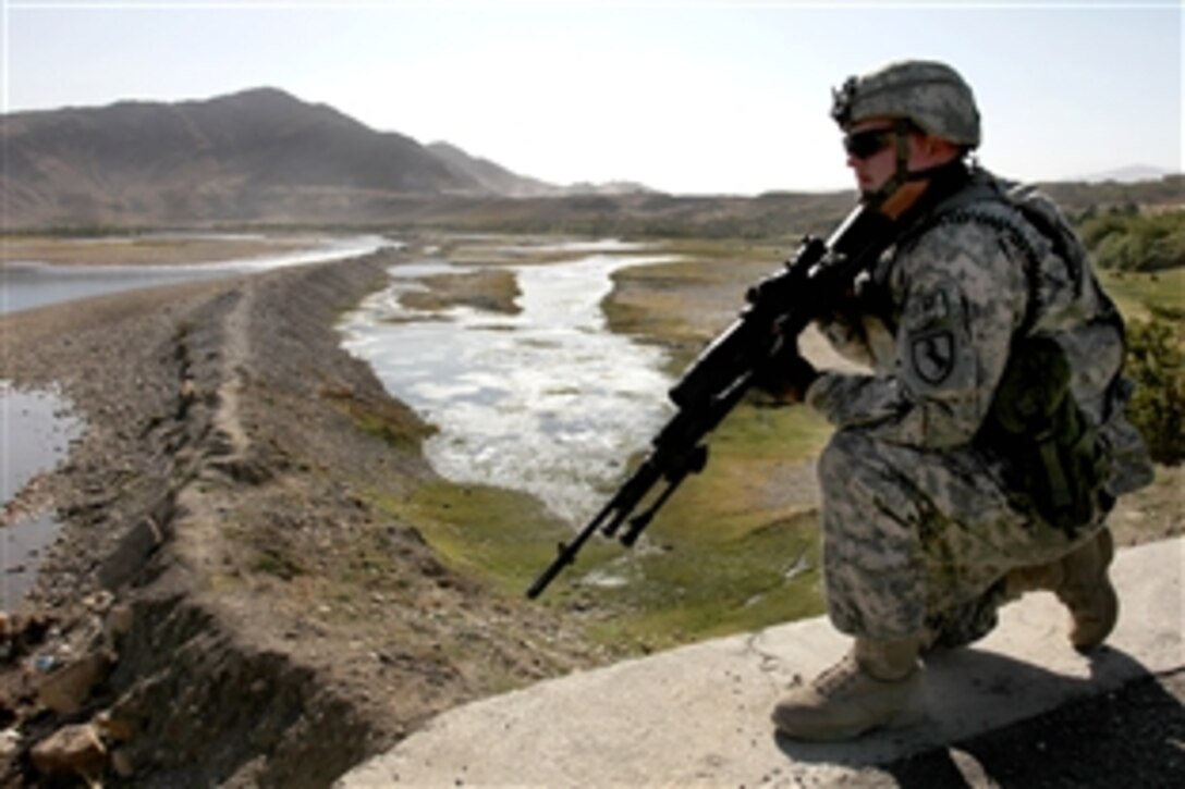 U.S. Army Cpl. Michael Tacker provides security while other members of the Kapisa-Parwan Provincial Reconstruction Team assess a bridge over the Panjshir River in Mahmood Rahqi, Afghanistan, Sept. 9, 2009. Tacker is an infantryman assigned to the  team.