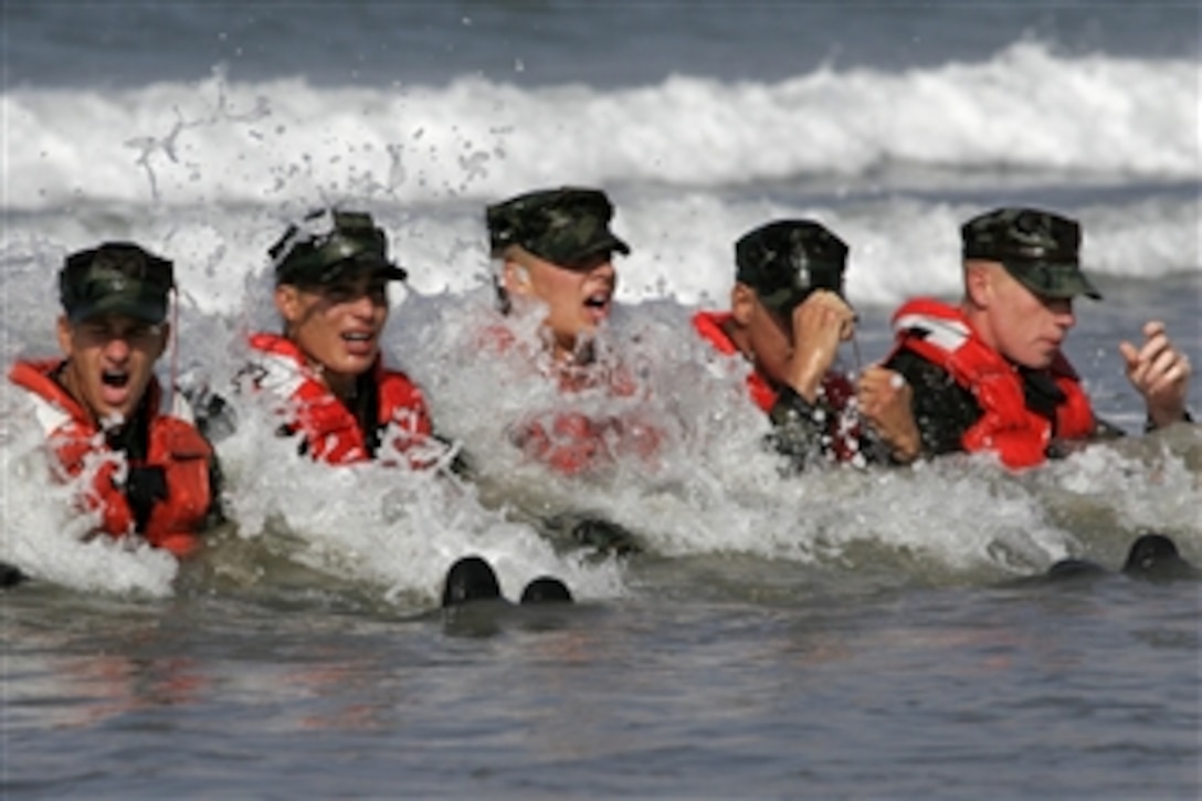 U.S. Navy sailors in Basic Underwater Demolition/SEAL Class 279 participate in a surf passage exercise during the first phase of their training at Naval Amphibious Base Coronado, Calif., on Sept. 10, 2009.  SEALs are the maritime component of special operation forces and are trained to conduct a variety of operations from the sea, air and land.  