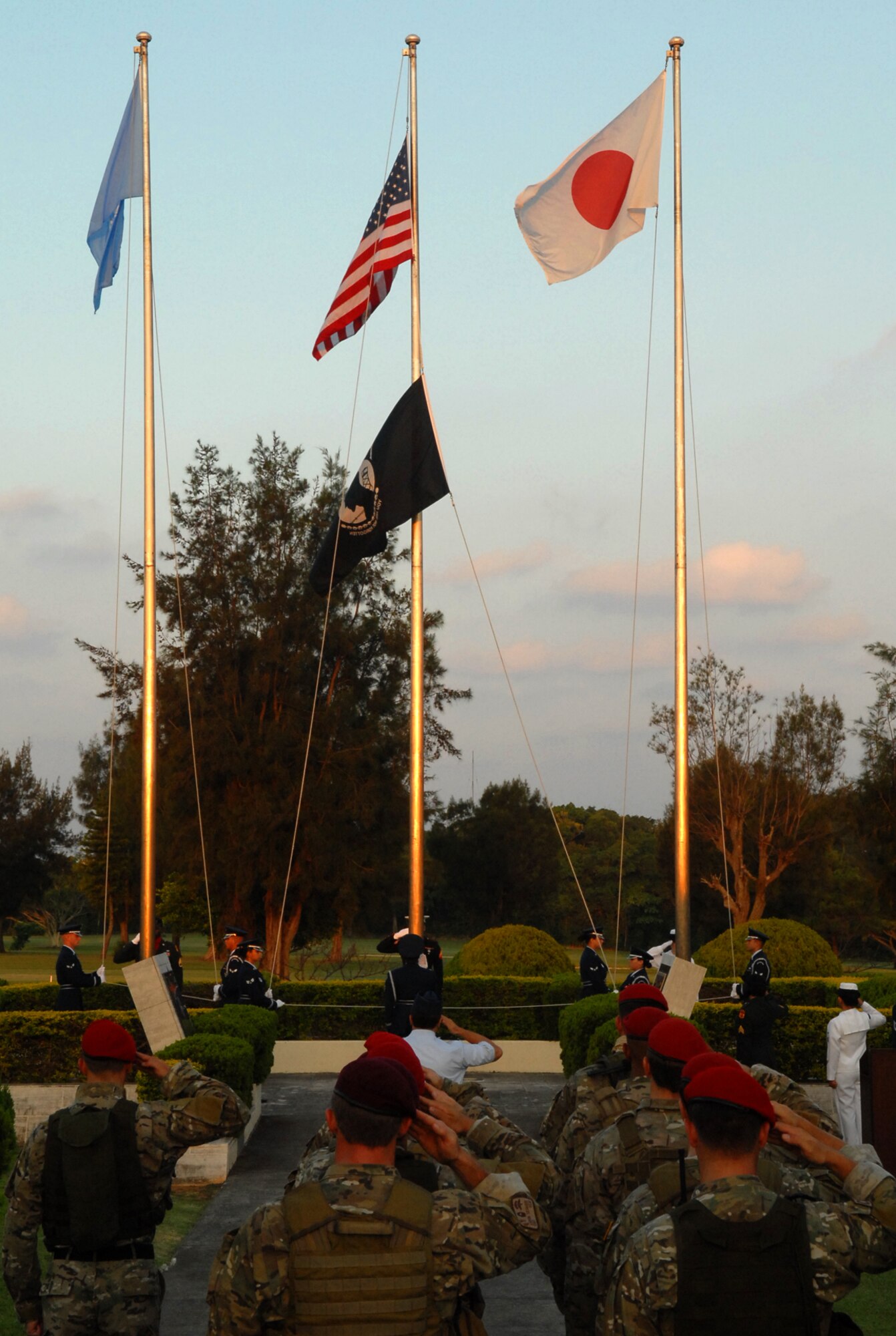 The POW/MIA flag is raised during a ceremony held at Kadena, Sept. 18. The POW/MIA ceremony honored the men and women of the US military services which were late or never returned home. (U.S. Air Force photo/Staff Sgt. Christopher Hummel)