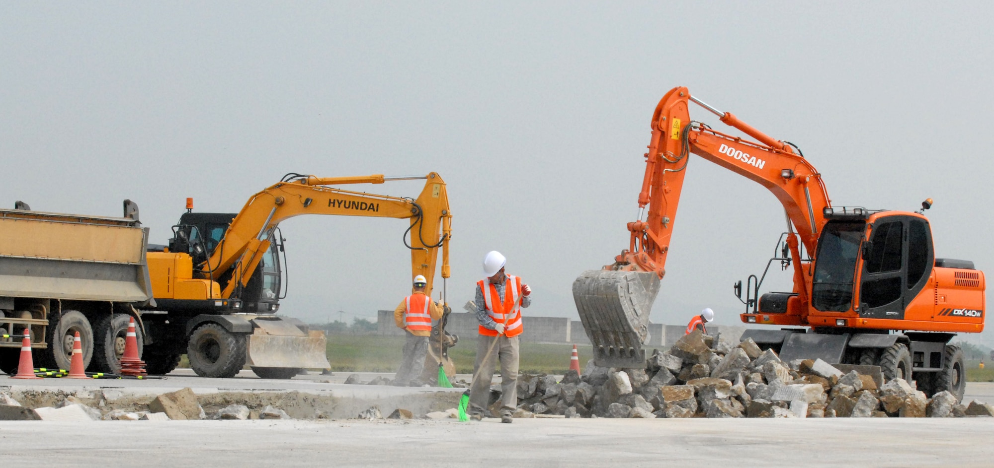 Contracted personnel from the Republic of Korea repair a large piece of the Osan Air Base flightline Sept. 17. The runway is scheduled to be closed for two weeks for major repairs. (U.S. Air Force photo by 1st Lt. Chris Hoyler)